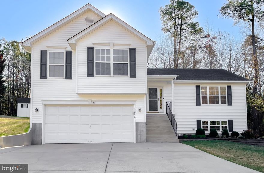 Welcome home to this meticulously kept split level home. Pride of ownership shines bright, with new LVP flooring and new paint throughout the home.  The new black stainless refrigerator and stove with built-in air fryer (!) were just installed and have never been used. The dishwasher and microwave are newer as well. Large windows bring the sunshine in to this lovely bright space. On this main level you will find the kitchen and breakfast area over-looking the deck and private backyard. The formal dining room flows into the front living space offering lots of room to spread out. Upstairs are three bedrooms, to include a large primary with two large walk-in closets. The primary bath has a soaking tub with separate shower new toilet and new black hardware. An additional hall bath finishes out this level of living. The lower level welcomes you to the den and separate laundry room.  Just steps away is a large finished recreation room with yet another full bath.  The sliding glass door in the rec room allows a comfortable walk-out to the side and back yards. The hot water heater and hvac were installed in 2020, a new roof in 2019 and new toilets were just installed throughout. Two sheds in the backyard convey (12x16 w/lofts and 7'6"x7'6"). This beautiful home is close to many conveniences-PAX River, restaurants and shopping. Come visit us soon as this beauty will not last!