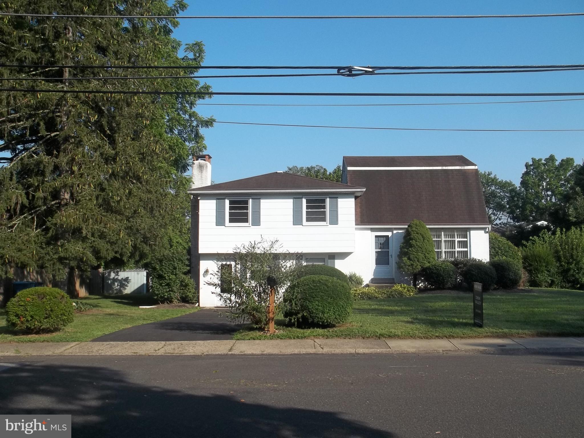 Single Family home in Doylestown Borough in established neighborhood! NO HOA FEES! 4 bedrooms 2 1/2 baths nestled in a quiet neighborhood. Boro location with parking ! New Driveway! This home comes with a Generac Generator! 1 owner! Well Maintained! Hardwood floors under carpets! Central Bucks school district. Affordable option for living in the Boro! Large family room on lower level with cozy brick fireplace leading to laundry room and half bath. Also features sunroom leading out to private back yard. Main level features living room and dining room combo along with kitchen with gas cooking. 3rd level with 3 bedrooms along with closets/storage and 1 full bath. 4th level with large primary bedroom, with his and her closets, plus addition walk in closets, along with storage and full bath. 4 levels of ample living space! Easy commute to major roads 202, 611, close to Doylestown Borough with tons of shopping and fine dining.