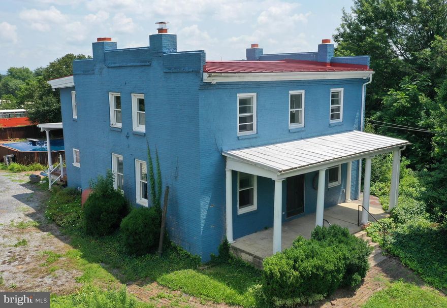 UNIQUE AND HISTORIC! UNPACK THE POTENTIAL OF THIS 214-YEAR-OLD SHENANDOAH VALLEY HOME AND TURN IT INTO AN ELEGANT SHOWPLACE!  If houses could talk, this one would speak volumes. Built in 1811, during the nation's infancy, it later bore witness to the Civil War in which it was said to have been a hospital. In 1864, it was a division headquarters for George Armstrong Custer. The flat roof facilitated its use as a flag signal station seen from high points in Winchester via telescope. Across the road is the final resting place of country music legend Patsy Cline and the bell tower erected in her honor.  Aside from history, today's buyer will enjoy this property's commuter-convenient location on Rt. 522, near routes Rt. 50 and Interstates 81 and 66.  Just a short drive to Winchester, Front Royal and Stephens City, restaurants, shopping, services and schools. On a 3.23-acre level corner lot with a 28x40 inground swimming pool that goes from 3 feet to 8 feet, with diving board.  Two-car garage, 25x40, with two garage doors in the front and one in the rear. Circular driveway.  Stately covered porches with pillars. The 8x24 front porch overlooks peaceful Shenandoah Memorial Park and the 12x24 back porch overlooks the swimming pool.  A grand entry door leads to a spacious living room lined with shelves, allowing it to double as a library and a showcase for antiques and collectibles.  Three fireplaces with mantles - two on either ends of the living room and one in the formal dining room. Recessed and track lighting. Up to six rooms serve as bedrooms, all with closets, including one on the main level with an adjoining full bath, and a large primary upstairs bedroom suite across the front of the house with two closets and an attached full bathroom.  A third full bath serves the other bedrooms. The large kitchen features flooring of repurposed random-sized marble tiles, a large pantry, and cabinets with two Lazy Susans. Mid-century knotty pine paneling is in the kitchen and two upstairs bedrooms. Separate formal dining room. New metal roof about 5 years old. House's brick was repointed about 10 years ago. Updated 200-amp electric service for the house and 220 in the garage. The owner uses the 1301 Front Royal Pike address but public records show it as 124 Laurelwood Drive. Sold strictly as-is. Measurements approximate. On well and septic. Septic may be for fewer bedrooms. Fireplaces are not in use and may need work. Moisture in the basement.