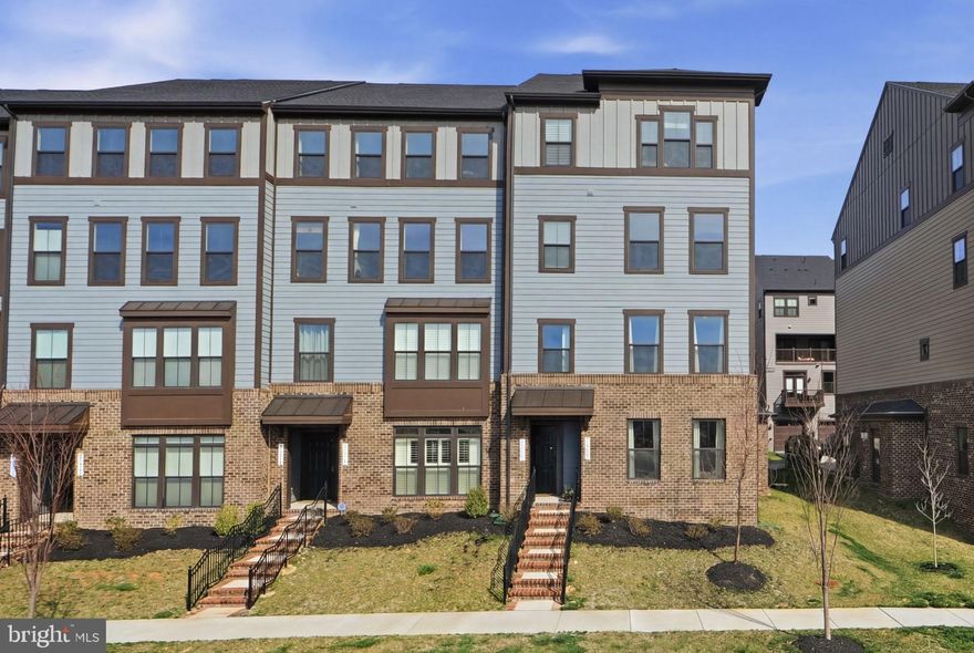 Experience the feel of brand-new construction without the delays in this beautifully maintained, like-new and truly move-in ready end-unit home in the highly sought-after Potomac Shores community.

This stunning 3-bedroom, 2.5-bath home with a 1-car garage has been meticulously cared for and shows like a model. Its desirable end-unit location allows for an abundance of natural light, filling every room with a bright, airy feel and creating a warm, inviting atmosphere perfect for both everyday living and entertaining. Additional street parking adds convenience for guests.

Only steps from the upcoming Potomac Shores VRE station—this home offers exceptional accessibility for commuters. Residents enjoy resort-style amenities including the Jack Nicklaus–designed Potomac Shores Golf Course, a beautiful clubhouse, state-of-the-art fitness center, multiple pools, and miles of scenic sidewalks and trails.

Enjoy the scenic beauty of the nearby Potomac River while being conveniently located to elementary and middle schools along with John Paul the Great.
This is your opportunity to be in one of Northern Virginia’s most vibrant and growing communities—schedule your showing today!