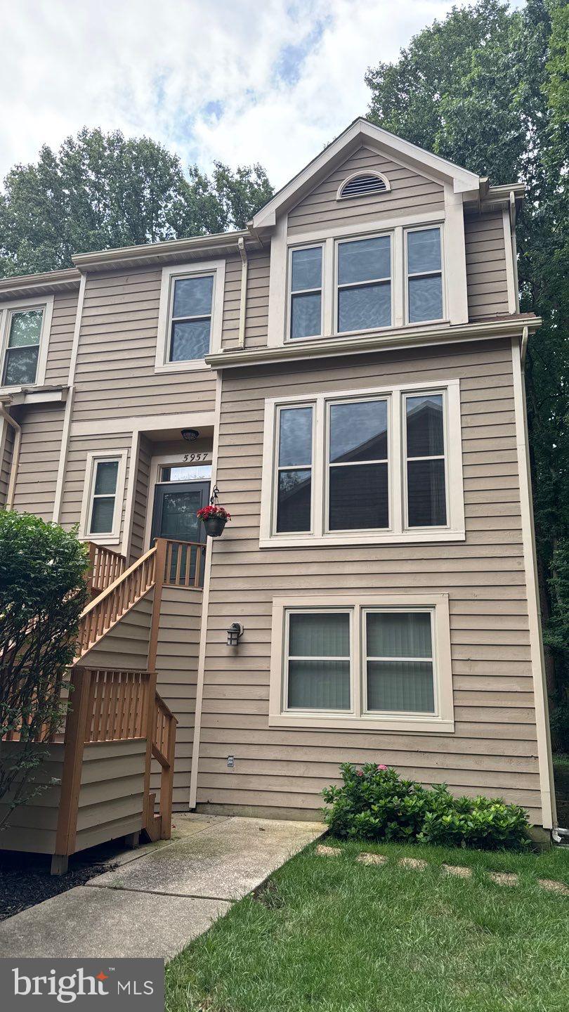 Beautifully maintained 3-level end-unit townhome offers a peaceful, vacation-like atmosphere in a prime location. Featuring numerous updates including newer windows, new skylights, a new roof, solar water heater, new washer and dryer, granite countertops, and more. The main level boasts a spacious eat-in kitchen with a convenient pass-through to the dining area, making it perfect for both daily living and entertaining. Step down into the bright and airy living room, complete with sliding glass doors that open to a large deck overlooking the serene, wooded backyard. Upstairs, the primary suite is a true retreat with two closets, an en-suite bath with dual vanities, a large linen closet, and private access to a balcony with peaceful forest views. Two additional bedrooms and a fully updated hall bath with dual vanities complete the upper level. Fully finished walk-out lower level provides even more space with a family room, full bathroom, kitchenette/wet bar, and a 4th bedroom ideal for guests or an in-law suite. Enjoy the convenience of walking to the nearby tot-lot. Pets considered on a case by case basis. 3 parking passes per unit.