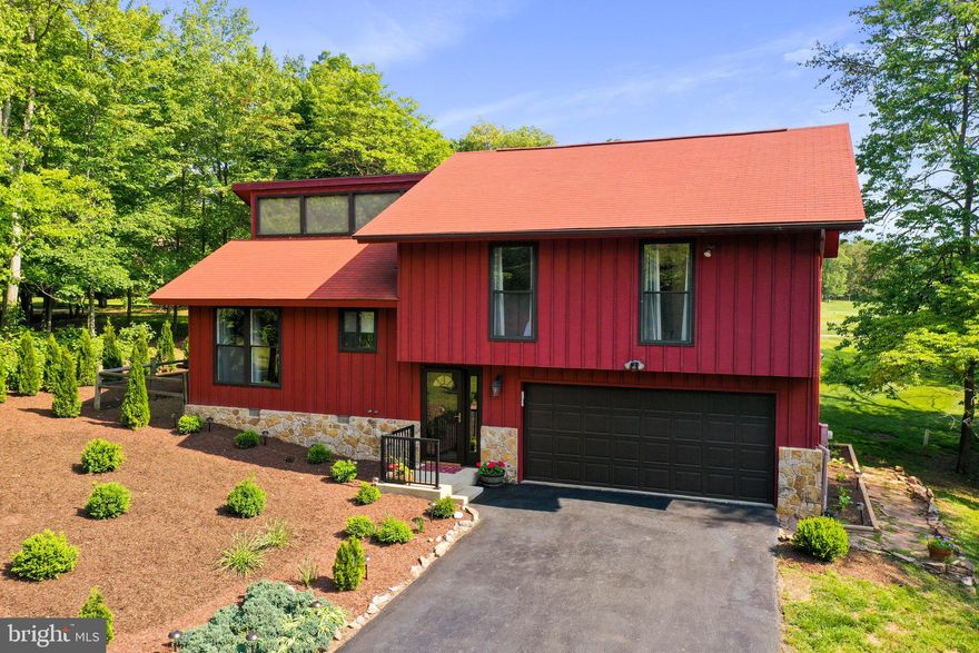 Beautiful view of the 17th fairway of The Mountain View Championship Golf Course! Wait until you see all the improvements that the owners have completed. New solid oak wood flooring on the main level and upper level and stairways. New updated main level bath with custom ceramic tiled walk-in shower, new vanity, faucet, toilet and lighting. 2  floor bath with new toilet, tile floor, new mirror and light fixture. New granite counter tops and new stainless steel appliances in the kitchen. Pantry closet in hall next to kitchen. New interior painting throughout. Installed new gas log unit in the fireplace in the great room. Added new landscaping which increased the curb appeal! Cathedral ceilings in all (3) bedrooms, living room, & dining room. Triple sliding glass door and clerestory windows in great room which adds lots of natural lighting. Ceramic tile floor at entry foyer. Exterior storm door at entry. Relaxing 10x12 screened in porch with open deck located behind the tee box of the 17th fairway that offers breathtaking views and lots of entertainment watching the golfers!! Half crawl space for additional storage(access in garage). Some furniture is negotiable. Bookcase in great room does not convey. Class A membership available.