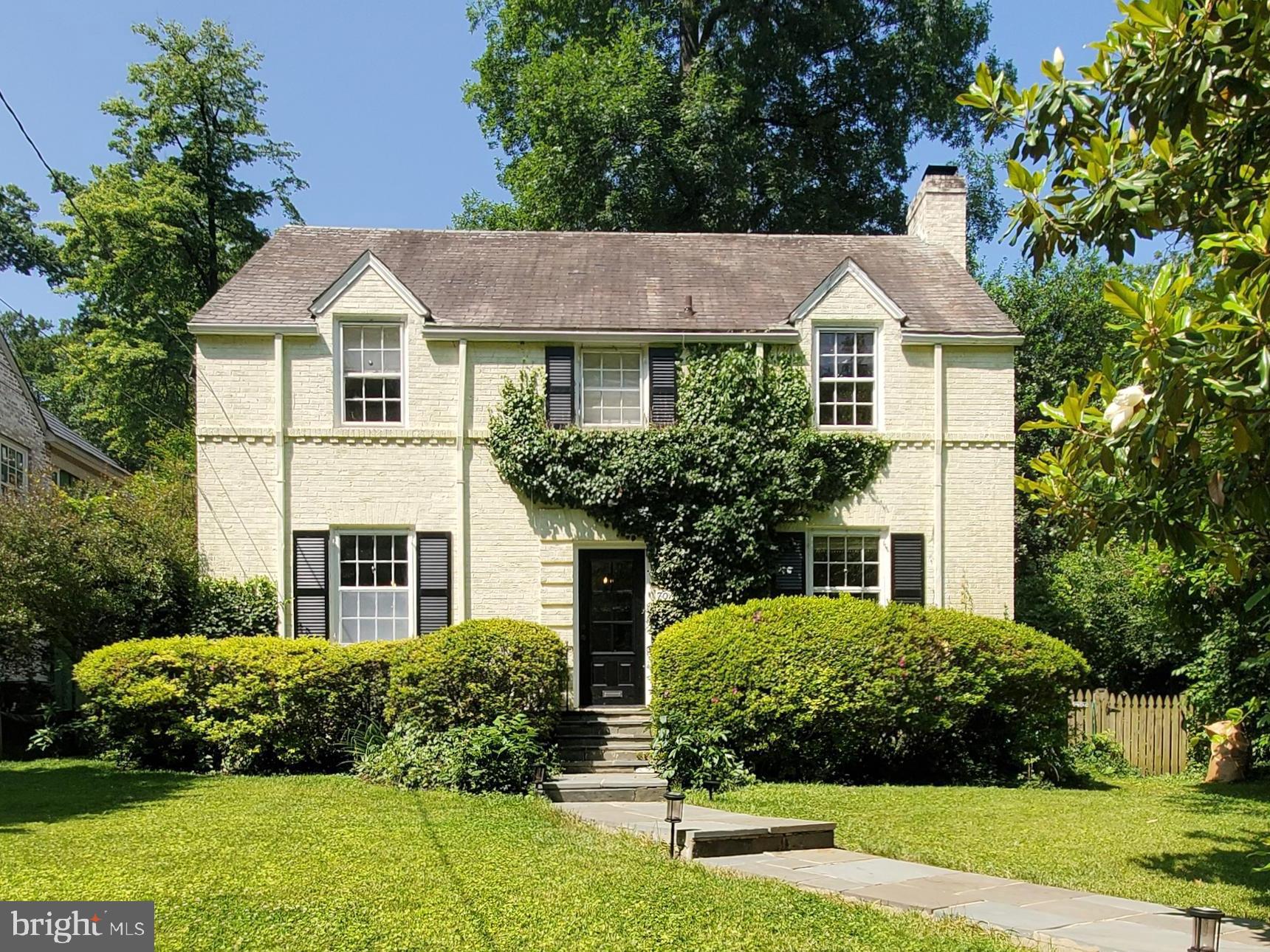 This storybook, four-level colonial will charm you, from its picturesque ivy to the rear stone patio and professionally landscaped gardens. When you arrive, you'll enter a welcoming foyer with distinctive marble flooring, custom, period archways with French doors, a sun room with walls of windows, and original hardwood flooring throughout the main and upper levels. In the elegant living room, you'll find peace curled up with a good book on the built-in window bench with custom bookshelves and a wood-burning fireplace. The upper level offers a spacious Owner’s suite with multiple storage closets and en-suite full bath, 3 additional bedrooms and hall bath, as well as a finished attic with a 5th bedroom. Shared driveway accessible through rear alley affords you the opportunity to pull up to the rear yard gate and family room and kitchen entrances. Located in desirable Chevy Chase Section 4, you'll love the many amenities right at your doorstep, from tree canopied streets and parks, to convenience to shopping and dining in Bethesda and DC. This appealing home is ready for you to call your own, and all just 1 mile to the Bethesda Metro Station. Enjoy!
