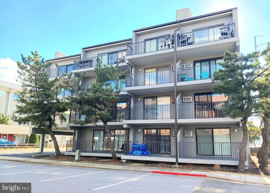 Enjoy easy first-floor living in this beautifully updated condo offering true convenience and an unbeatable mid-town location. Step outside to a large private balcony—perfect for morning coffee or unwinding after the beach. The unit includes two assigned parking spaces, one is covered and right outside your door, making access effortless. No more hauling luggage and groceries up the steps!

Inside, low-maintenance tile and luxury vinyl plank flooring flow throughout, complemented by an electric fireplace that adds warmth and ambience on chilly nights. The upgraded kitchen features stainless steel appliances, soft-close cabinetry, and granite countertops, while both bathrooms have been tastefully renovated.

Ideally located within a short walk to popular restaurants, shopping plazas and mini-golf—and just steps from a wide, pristine beach—this condo is perfect as a vacation home, or investment opportunity. Easy living, thoughtful upgrades, and an exceptional location all come together here.