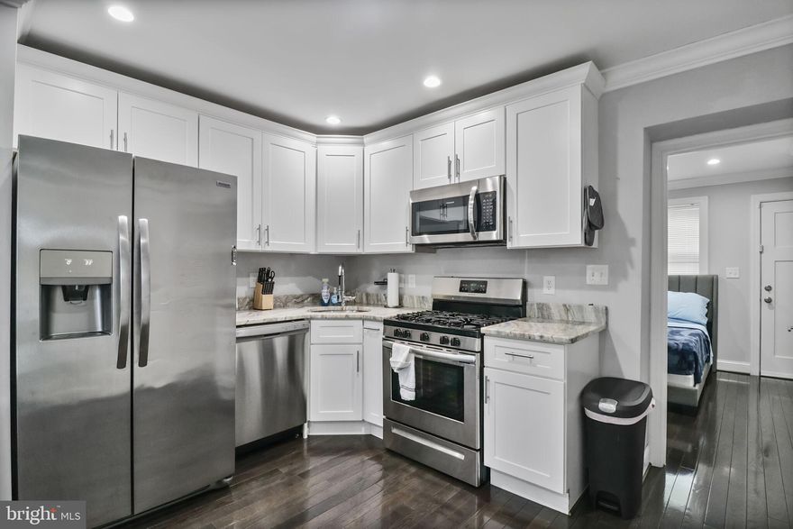 JUST REDUCED!  There is a $10,000 Grant available toward the purchase of this home.  You can use the Grant Funds toward the home's down payment or closing costs.  This home also offers all the modern comforts you would want in a home with a minimum downpayment.  This is a fantastic fully renovated 3BR/2.5 Bath semi-detached home which is minutes away to the Anacostia Metro Station, Suitland Parkway, and Route 295 which will have you downtown in five minutes.  The first floor has a one bedroom en-suite, hardwood floors, open kitchen with stainless steel appliances, granite counter tops, powder room and first floor laundry.  Imagine your parents coming to visit and they can stay on the main level without having to climb the stairs since everything they require is situated on the main level.  The other two bedrooms are located on the second floor with a complete bathroom.  One of the bedrooms on the second floor has an alcove where you can store items or put decorative pieces in the area.    That would be my bedroom.  Come see!  You will love this house.  I forgot to mention that there is a shed in the fenced back yard for extra storage.  The Seller is motivated and is willing to help with the closing cost.  What more could you ask for?  I am waiting for your offer.