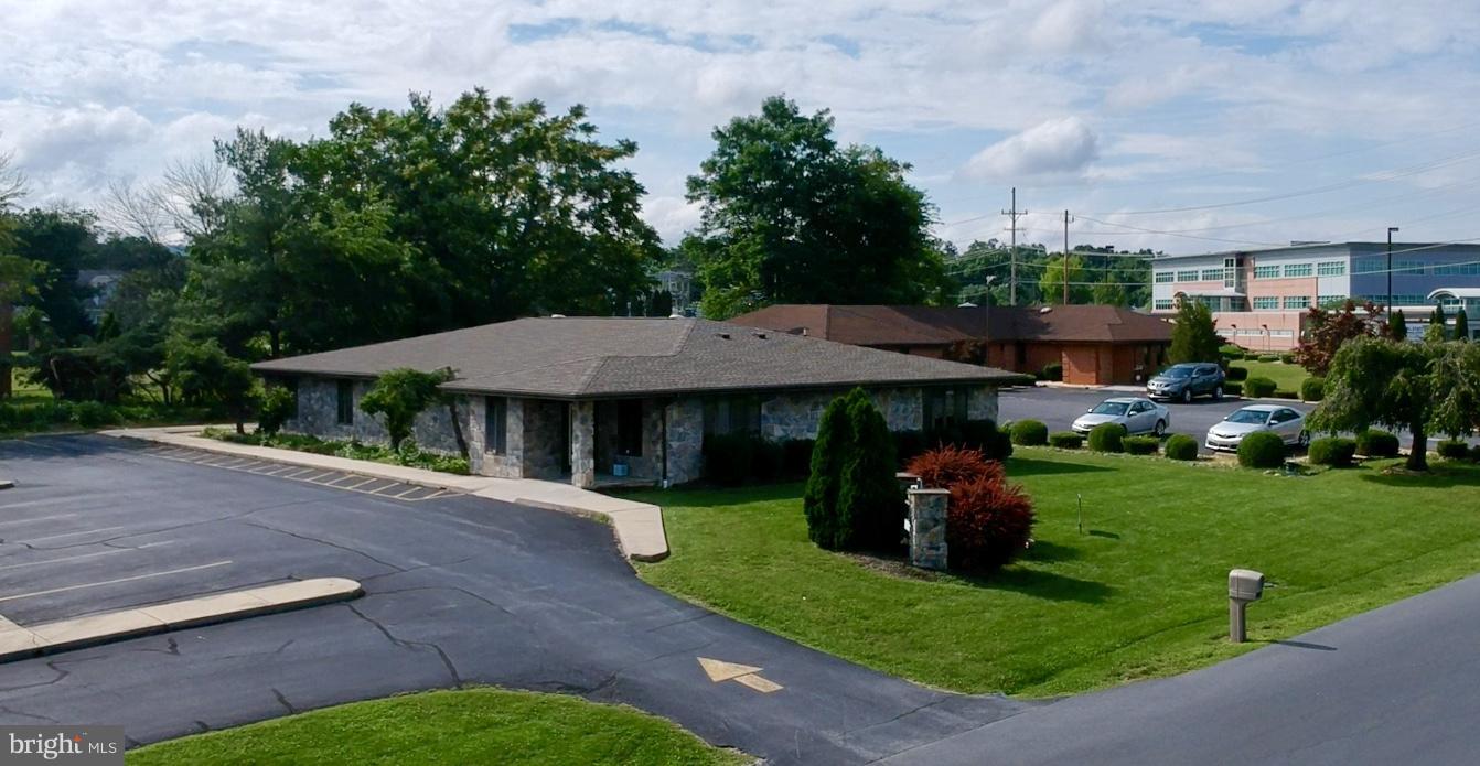 Prime medical office investment opportunity in the heart of Martinsburg. This well-maintained, single-story medical building offers approximately 3,484 SF of functional space currently leased to WVU Medicine, a major healthcare provider with a strong operating history. The property features six exam rooms, three private offices, a large reception area, waiting room, triage space, and multiple restrooms, all designed for efficient patient care and workflow.
Situated on a .66-acre lot with 32 lined parking spaces, this property is ideally located within the established Medical Court professional park, just steps from Berkeley Medical Center and other regional healthcare services.
Current lease has an annual 2% rent escalations, offering additional stability and predictable cash flow for investors seeking long-term security.