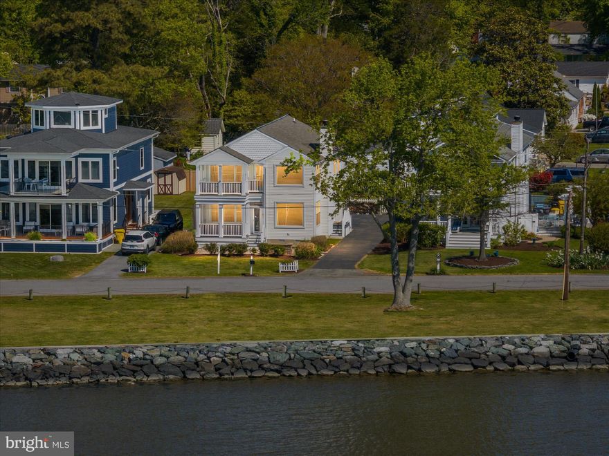 Welcome to your Chesapeake Bay retreat in the sought-after Franklin Manor Beach community—where the water isn’t just nearby… it’s right there. This unobstructed Chesapeake Bay view home delivers sweeping 180-degree water views from multiple vantage points, including the private upper deck off the primary suite and guest bedroom, as well as the main level and screened-in front porch—perfect for soaking in both breathtaking sunrises and vibrant sunsets. Inside, you’ll find hardwood floors and an open-concept main level designed for everyday living and effortless entertaining. The kitchen features stainless steel appliances, granite countertops, and flows seamlessly into the main living areas. Just off the front, the screened-in porch offers a peaceful place to enjoy the Bay breeze and those stunning, uninterrupted water views—without the pests. The spacious primary suite is a true retreat, offering a substantial walk-in closet and a well-appointed en suite bath complete with a stand-up shower and separate soaking tub. Two additional generously sized guest bedrooms provide comfort and flexibility for family or visitors.
This home has been thoughtfully upgraded for efficiency and peace of mind, including Andersen Windows SmartSun high-performance double-hung windows (2020), ProVia doors (2020), and an encapsulated crawlspace. The high-efficiency 18 SEER heat pump with integrated air purification system (2020) enhances comfort year-round. Additional features include Hunter Douglas Silhouette motorized blinds (2024) on the main level and motorized honeycomb blinds in the primary bedroom. Exterior highlights include a one-car attached garage, a fully fenced rear yard offering privacy and space to enjoy outdoor living, and a convenient storage shed. Don't worry, the wifi operated automatic pet door will convey! Located in the water-privileged Franklin Manor Beach community, residents enjoy access to two fishing piers, a private beach, playground, basketball courts, baseball field, picnic and grilling areas, and a vibrant calendar of community events. Ideally situated for commuters, this home offers easy access to Washington, D.C., Annapolis, Northern Virginia, Route 50, and is approximately 30 minutes to Joint Base Andrews. Now is your opportunity to live your best life along the Chesapeake Bay—where the views are front and center, every single day. ****Sunset Open House Thurs 5/7 5pm-7:30pm**** NO HOA, NO FLOOD INSURANCE REQUIRED