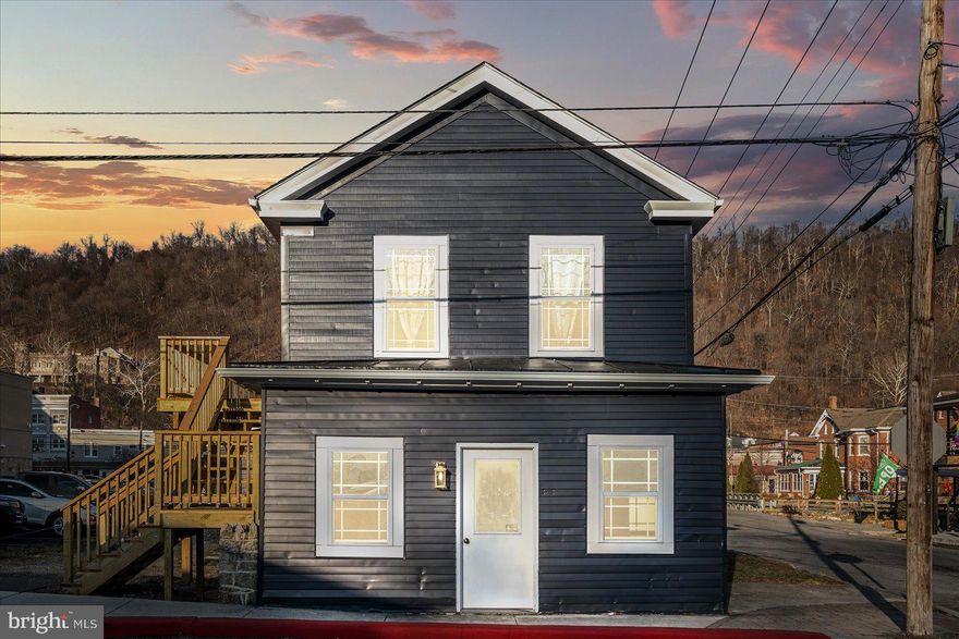 Now available for lease at 49 N. Mercer Street, this completely remodeled commercial space is located on a prime corner lot in the heart of historic downtown Berkeley Springs. Positioned in an up-and-coming area with excellent visibility and walkability, this location offers a rare opportunity to establish your business right in the center of town.

Perfect for a professional office, the space features two conference rooms or could be two offices, a kitchenette, and one bathroom, all thoughtfully designed to be both functional and welcoming. The recent renovation provides a clean, modern feel while still complementing the charm and character that Berkeley Springs is known for.

Surrounded by downtown shops, restaurants, and local attractions, this space offers both convenience and prestige in one of West Virginia’s most sought-after small-town destinations. A standout opportunity for professionals seeking a polished office in a prime downtown setting.