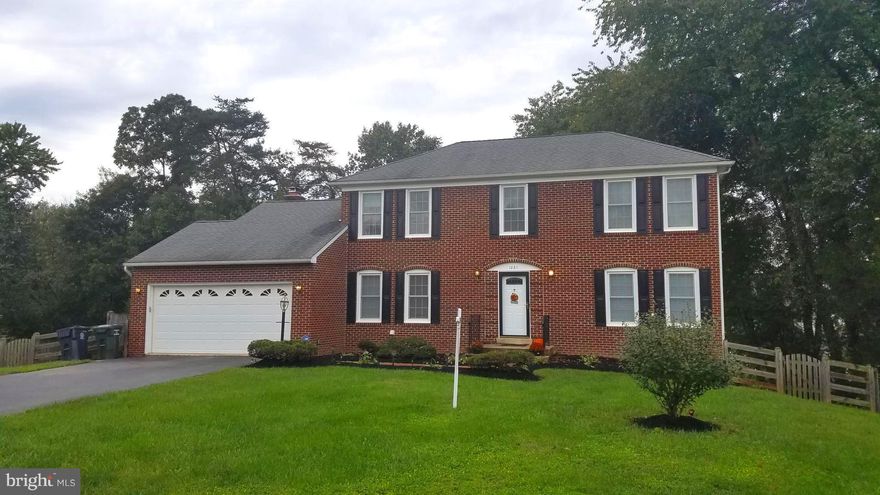 Beautifully updated hip-roof, brick front colonial features gleaming wood floors throughout the main level. Gorgeous kitchen features granite counters, mosaic back-splash and stainless appliances. All new Thompson Creek windows, new sliding doors, front door and new front storm door.  HVAC replaced in 2012.  All this and more perfectly situated on an extremely large lot with a fenced back lawn.