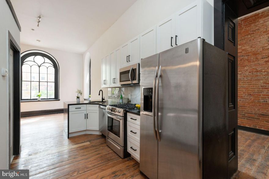 Newly renovated 3 bedroom bi-level unit. This unit features white cabinets and quartz countertops in the kitchen along with hardwood floors throughout. The original church windows allow for plenty of natural sunlight. Sizeable bedrooms with closets in each. Washer/dryer in unit. Building has a common patio, package room, elevator, and secure entry.