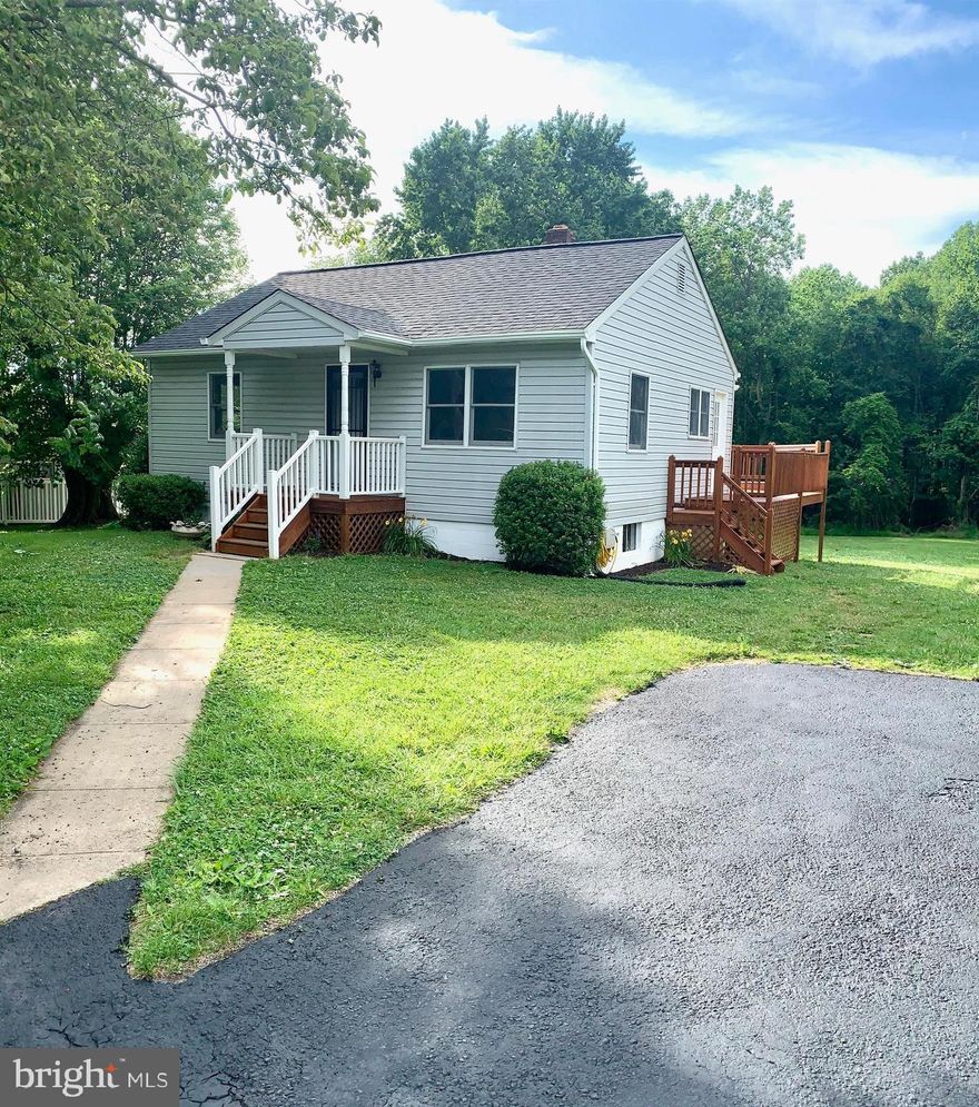 Ultra charming move-in ready cape is nestled perfectly on a 1/2 acre oasis! Fully renovated and sunlit with gleaming hardwood floors through-out, granite countertops, brand new stainless appliances and SO much more! Enjoy the quiet of "country" living while just minutes from major commuter routes, shopping and dining. Come relax on the large rear porch in a tranquil atmosphere. The is also an oversized garage/shed that is perfect for additional storage. Come and tour this completely updated home today! You won't want to leave!