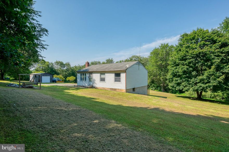 If you're looking for a private/serene setting, you have found your home! Nestled on just over 3 beautiful acres, this three-bedroom / one-bath rancher offers peaceful country living.   Buyer to verify subdividing rights. Basement is unfinished with laundry area and additional full bath (bath needs renovation).  One car detached garage.  Home is being sold As-Is.  Estate Sale.  Seller will make no repairs.   DO NOT WALK ON DECK.  Do not go down driveway unless you have a scheduled appointment.