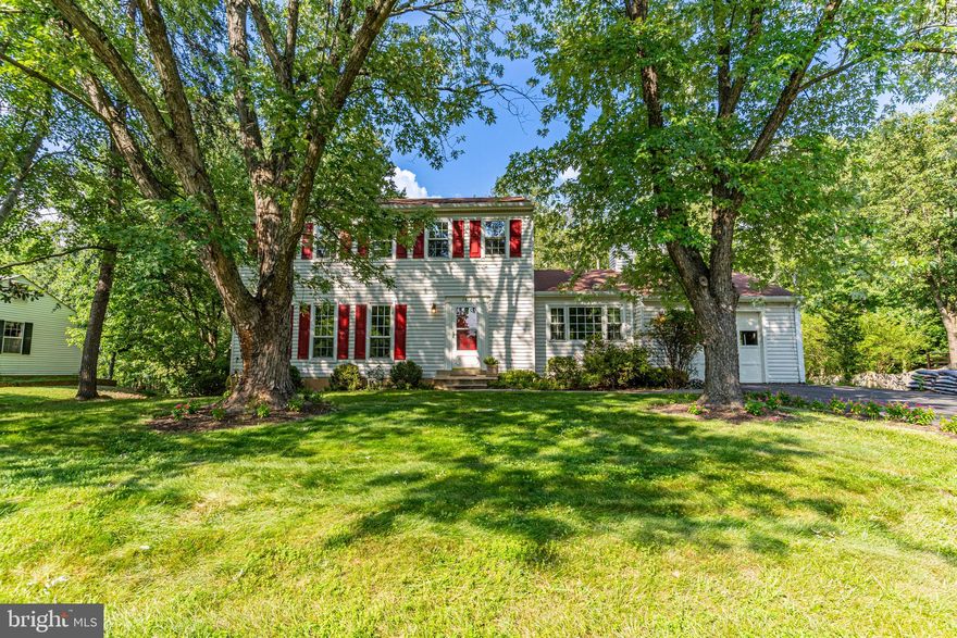 All offers to be submitted no later than Tuesday by 5:00 PM. Welcoming colonial sitting on an amazing 1/2 acre lot. Updated Kitchen includes Granite Countertops, and breakfast bar, and recessed lights.  Sun filled Living Room with hardwood floors, and Dining Room with chair molding and easy access to the kitchen.  Huge Deck and back yard which backs to Parkland & Trails.  Primary bedroom is spacious and has a en-suite Full Bath with double sinks and Separate Jetted Tub and separate shower for your own private spa-like feel! Walk-In Closet. Total of 3 Bedrooms.  Second Full Bath also has a Jetted Tub!  Gas Fireplace in the Family room perfect for those cozy get togethers.  One Car Attached Garage with a super long driveway. Washer and Dryer in the lower level. Newer Furnace, A/C, Windows, Siding  and Roof. Convenient to the Metro Silverline and Reston Town Center!