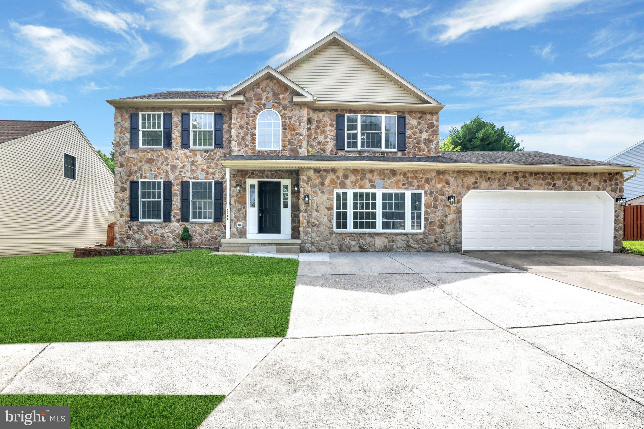 Welcome to 3711 Green Oak Ct—this beautifully updated home blends modern luxury with everyday comfort! The stunning two-story foyer opens to elegant living and dining rooms, plus a versatile main-level rec room perfect for a home theater or extra living space. The showstopping kitchen boasts a large island, quartz countertops, brand-new stainless steel appliances, and sleek lighting, flowing seamlessly to the cozy family room with a modern gas fireplace. Upstairs, the spacious primary suite features a large walk-in closet and spa-like bath with dual vanities and soaking tub. The lower level offers abundant space for fun and activities, a bedroom/office, generous storage, and laundry. Enjoy a two-car garage with extra storage and a spacious rear deck—ideal for entertaining or relaxing. All on a peaceful no-outlet street. Don’t miss the opportunity to call this beauty of your own schedule your private tour today.