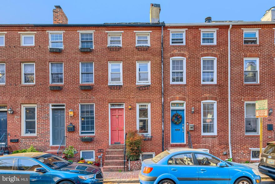 Tucked into the city’s history, this 1850 home and located in the heart of the Federal Hill Historic District, this hous is full of character and ready for its next chapter.

From the moment you walk in, you’ll notice the original wood floors, exposed brick, custom millwork, and a decorative fireplace in the living room that speaks to the home’s past. Upstairs, one of the bedrooms features a second decorative fireplace along with original beams, adding warmth and a sense of history you just can’t recreate. There is also an additional room on this level that works beautifully as a petite guest room, studio, or home office. With two bedrooms, two full baths, and an additional half bath in the basement, the layout offers flexibility for how you live.

The kitchen is efficient and functional, with a peninsula for prep or casual meals and a terracotta backsplash that adds a bit of personality. Out back, the courtyard is a great little space that could become a container garden, a tucked-away spot for morning coffee, or a place to dine under the stars on a warm summer night. There’s also a roof deck for even more outdoor space.

The home is perfectly livable as it is, with an opportunity for updates over time. It is being sold as is, and the price reflects that opportunity.

The basement includes laundry and a half bath and is best suited for storage.

If you’ve been waiting for something with charm, history, and the chance to make it your own over time, this could be it.