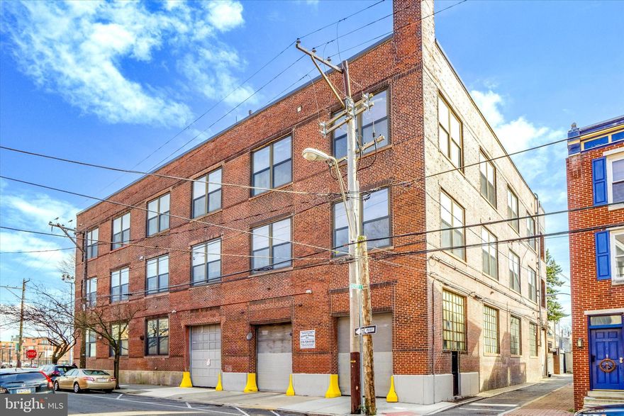 Experience the ultimate in urban luxury living in this bi-level 4-bedroom, 5-bath loft with 2-car garage parking in the heart of Center City! With 14-foot ceilings and sweeping city skyline views this extraordinary residence is a must-see. Embrace serene "penthouse" living in this exclusive 3-story boutique elevator building which boasts just (12) units for an intimate and refined urban lifestyle. As you step in, you’ll be welcomed by custom hallway moldings and oak hardwood flooring which extends throughout. The expansive “L” shaped living room, dining room and kitchen captivates you with exposed brick and ductwork and eight 10ft x 9ft windows. Culinary enthusiasts will appreciate the gourmet kitchen equipped with Gaggenau, Thermador, Sub-Zero and Bosch appliances, Boland Woodworking custom cabinetry, double oversized Soapstone stone islands and a Waterstone Gantry Hook faucet. A custom ladder from Putnam Rolling Ladder Co. seamlessly blends functionality and style in this impressive space. Entertain effortlessly in the dining and living rooms adorned with Antique Holophane light fixtures and Hudson Valley Lighting Chambers Pendant Chandeliers. A spacious family room is located just off the main entertaining area and features a wall of custom millwork with built-in storage and shelving. The cedar plank ceiling and original timber beams add a touch of rustic charm to the contemporary design. Luxury extends to the 4 private bedroom spaces as well. The primary suite is spacious with a custom Laren walk-in closet from the Container Store and the bath features Century Bathworks windowpane shower doors, Victoria & Albert freestanding tub, and Newport Brass hardware. The main level offers an additional bedroom suite and the upper level has two additional bedrooms and a hallway bath with heated Carrera marble flooring and subway tile. An full office with a built-in walnut desk overlooks the family room and offers city skyline views as well. Just outside the office and bedroom area is an open loft space which currently serves as a gym/fitness area with a full bath alongside. Gallery picture hanging rails and rods throughout offer a unique opportunity for art enthusiasts to showcase their collections. Complete with 3 HVAC systems, additional storage room & two-car parking, this home defines city living at its finest. Don't miss the chance to make this meticulously crafted space your own!