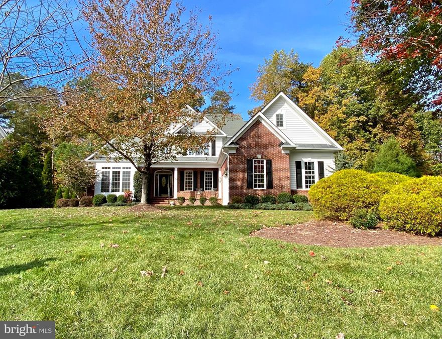 Gorgeous custom Dream Home located inside the premier luxury gated Fawn Lake Community of Fredericksburg!
A welcoming front porch enhances the charming exterior design. Inside, a two-story Foyer opens to a beautiful custom floorplan accented with gleaming hardwood floors, large windows offering plenty of sunlight, and beautiful details throughout. The grand two-story Family Room features a spectacular wall of windows offering incredible views of nature. 
The  Gourmet Kitchen with custom Cherry Cabinetry, granite countertops, and a large Butler's Pantry offers ample space for preparing meals, and entertaining.  An inviting Breakfast Room with access to the  amazing screened Porch, flows into a charming Family Room  with a cozy gas fireplace. 
The Formal Dining Room is perfect for hosting elegant gatherings.  A spacious main level Owner's Suite with double walk-in closets and luxurious Spa Bath with large soaking tub and tile shower offers abundant comforts to unwind and relax. 
A Guest Bedroom with an adjoining Full Bath serves as an optional Office.  The Laundry Room with built-in plenty of storage cabinets completes the main level. 
The Oak staircase leads to a spacious Loft for a multitude of flexible living options. Two gracious Bedroom en-suites  with Full Baths, plus a large unfinished space complete the upstairs.
With unlimited possibilities, the huge unfinished Basement offers plenty of space for future expansion  and storage! 
 The private backyard, which abuts to a wooded Conservation area, was designed for enjoying the beautiful sights and sounds of nature. 
Designed to maximize breathtaking outdoor scenery, the home is nestled on a deep  .64 Acre lot filled with mature hardwoods and lush landscaping. Perfect for taking in the beautiful sights and sounds of nature, the charming screened porch and large deck offer idyllic space for extended outdoor living and entertaining.  
An array of flowering shrubs and beautiful ornamental trees highlighting the manicured grounds. Sited in a desirable  established area, right in the heart of the community. Conveniently located playgrounds, the walking and biking path that leads to the pool, beach, tennis courts, and the Fawn Lake Country Club!

The grounds are easy to maintain with the in-ground irrigation system. 
**The beautiful Luxury Fawn Lake Community offers amazing amenities such as a boating recreational lake, beach, Arnold Palmer designed golf course, tennis courts, baseball and soccer fields, dog park, volleyball courts, walking trails, Community Club House, marina, fitness center, restaurants, Country Club, playgrounds, and so much more! Located in the countryside near the town of Fredericksburg, surrounded by park lands and only a few miles to the farm market, wineries, and award winning breweries!