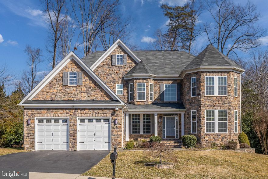 This MUST SEE home is one of the largest models in West Springfield's premier Belmeade neighborhood and is almost 7000 sq ft. (including basement, garage, etc.).  It is a gorgeous 5 bedroom 4.5 bath home, 3 car garage home that has extraordinary curb appeal due to such features as a stately stone facade with turrets and covered flagstone front porch. Beautiful landscaping & outdoor accent lighting. Breathtaking 2 story foyer; expansive, open concept floor plan with marble tile and warm engineered wood flooring, 2 staged crown molding, wide baseboards, recessed lighting and featuring: commercial grade stainless steel appliances (Built-In Microwave, Viking Commercial Range, Viking Commercial Refrigerator/Freezer, Viking Dishwasher), pot filler, Butlers Pantry/sous sink, farm sink, Blanco faucet, ceramic tile backsplash, maple wood cabinets, premium granite island counter with gorgeous drop lighting fixtures. Sunroom/breakfast room adjacent to kitchen area. Mother-In-Law Suite  on main floor next to sunroom/breakfast room which has its own full bath. On the other side of the kitchen is a relaxingly spacious family room with a gas fireplace. Built-in speakers and sound system throughout interior of home, plus a home theater projector in front room. Exit through the living room, down the stairs to incredible backyard featuring: extensive hardscape, flagstone/stacked stone terrace, full outdoor kitchen with bar area, stainless steel appliances (grill & sink). Tranquil master suite with a breathtaking, master bath, huge walk-in closets, tray ceiling, wall of windows, and sitting area with cozy gas fireplace. Master bath offers dual flat paned vanities w/ granite counters, Soaking tub with glass tile backsplash, custom tile inlay, seamless glass shower door & contemporary lighting. 4 total bedrooms on bedroom level provide 2 bedrooms with private baths and 2 bedrooms that share a Jack and Jill bathroom. Bedroom level laundry room completes the upper level making life a breeze. Retreat room / sitting room in the upper level is spacious and would be a great office space for working at home. Bonus Features: irrigation system; LCD for Camera video; video monitoring for both interior and exterior; intercom system; 3 wall mounted flat screen TVs; home theater projector; dual HVAC system.

This beautiful home is located within walking distance of South Run Regional Park & Recreation Center offering access to ballfields, tennis and basketball courts, a large indoor pool, and a state-of-the-art fitness center.  It is in walking distance to Mercer Lake with nature trails for nature walks, jogging,  and biking.