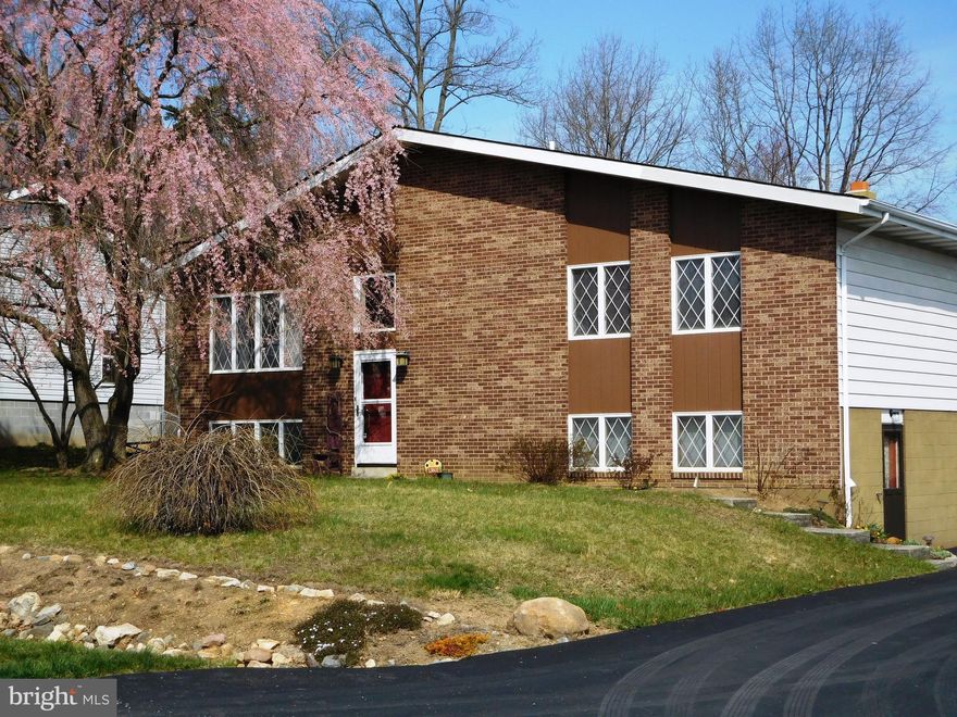 You'll love the charm and craftsmanship of this stunning Glenwood Acres split foyer! Featuring vaulted ceilings, a large master suite, large family room with a gas (propane) fireplace, level yard, and GREAT CURB APPEAL. Located on a quiet dead-end street, yet convenient to LaVale, Cumberland, ATK, American Woodmark, and more! Call today. This one won't last long!