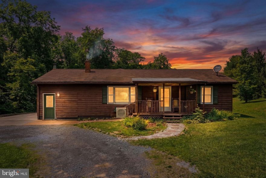 Tucked away on over 3 acres of private wooded land, this charming rambler offers the peaceful retreat you’ve been dreaming of. Imagine mornings spent gathering fresh vegetables from your garden, evenings around the fire pit under the stars, and quiet afternoons enjoying the beauty of your own small pond.
The outdoor space is designed for both relaxation and gathering. A beautiful flat yard leads to a stone patio, covered pavilion, and a stunning stone-surround grill—perfect for summer cookouts, celebrations with friends, or simply unwinding in nature.
Inside, light-filled spaces create a warm and welcoming atmosphere from the moment you walk through the door. The spacious living room invites you to settle in and feel at home, while the cabinet-packed kitchen with granite countertops and tile flooring provides the perfect place to cook, connect, and create memories.
A large storage area with a laundry room and cozy wood stove adds practicality and charm. The home also features three generously sized bedrooms, each offering ample closet space and comfort.
If you’re looking for privacy, space, and a place where life slows down just enough to enjoy it, this special property is ready to welcome you home.