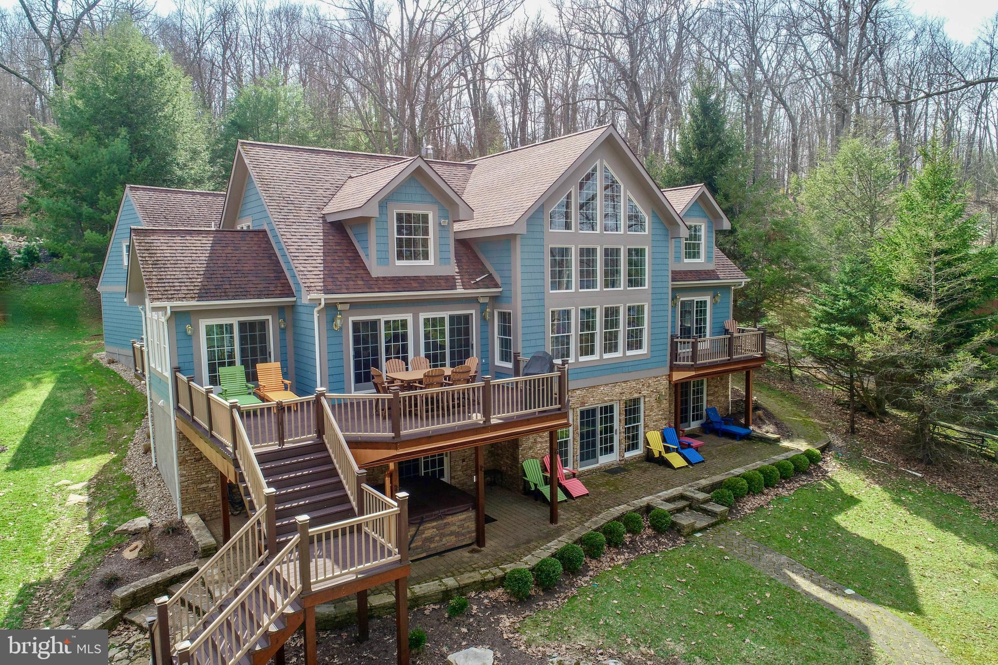 Unmatched EXCEPTIONAL Lakefront Living – 6 Bedrooms | 7.5 Baths | Tucked Among the Pines
Discover a rare opportunity to own a true lakefront, lakeview gem—this 5,400 sq ft, 6-bedroom, 7.5-bath home that is nestled among tall pines on an exceptional lot that sits unusually close to the water’s edge. With peaceful views across a quiet cove and expansive open-water vistas from the oversized covered dock, this property offers a front-row seat to lake life at its absolute best.
Inside, the soaring vaulted wood ceiling living room, with a beautifully done stone fireplace, welcomes you with warmth and charm. Paired with a dramatic wall of glass that frames a tranquil view of the sparkling water beyond. It’s a space that brings the outside in and makes every season feel like a postcard.
The open layout continues into a spacious dining area and a gorgeous kitchen with soapstone countertops, viking stove, a wood-topped island, a large walk-in pantry, and a bright breakfast room surrounded by windows. Step out to one of two lakeside decks—one perfect for outdoor dining, the other for grilling—all just steps from the shoreline.
The main-level primary suite features its own private deck overlooking the lake, a walk-in closet, attached bath with a large shower. Upstairs, three generously sized bedrooms each have their own ensuite bath, extra large closets—two with built-in window seats ideal for curling up with a book and taking in peaceful lake views.
The lower level is designed for comfort and fun, offering a family room and recreation area, custom built-in cabinetry with a wet bar, a wood burning stone fireplace, another spacious, private bedroom suite with a walk-in closet, and walk-out access to the lake. Multiple closets for maximum storage. A full bath is conveniently located off the mudroom. Step outside to relax in the hot tub overlooking the lake. The bath is perfectly situated for rinsing off after a soak in the hot tub or a swim in the lake.
Additional highlights include three tankless water heaters, in-floor radiant heat in the lower level, two mechanical rooms, and ample storage space. The newly redone laundry room is a dream come true with a deep utility sink, generous folding and hanging space, and two sets of full-sized stacked washers and dryers.
Above the laundry area, a wonderfully private upper-level suite offering a cozy bedroom, sitting area, and a stylish full bath with a walk in tiled shower—perfect for guests, extended family, or an office retreat.
Outside, enjoy your evenings around the lakeside fire pit for s'mores and stories, or relax on the oversized covered dock that puts you right on the water. This is not just lakefront—it’s EXCEPTIONAL lakefront, with the house sitting closer to the shoreline than most, offering rare intimacy with the lake itself.
An attached two-car garage, paved driveway, and ample parking make a year-round access a breeze- whether you're seeking a full-time residence or a vacation getaway.
Private. Peaceful. Perfectly positioned—this lake home is an extraordinary retreat that must be experienced to be fully appreciated. Call today for your private tour!
5 Bedroom Rental Projection...$97,835 - $112,440. 6 Bedroom Rental $110,035 - $126,940, 6 Bedroom would require a sprinkler system to be installed.