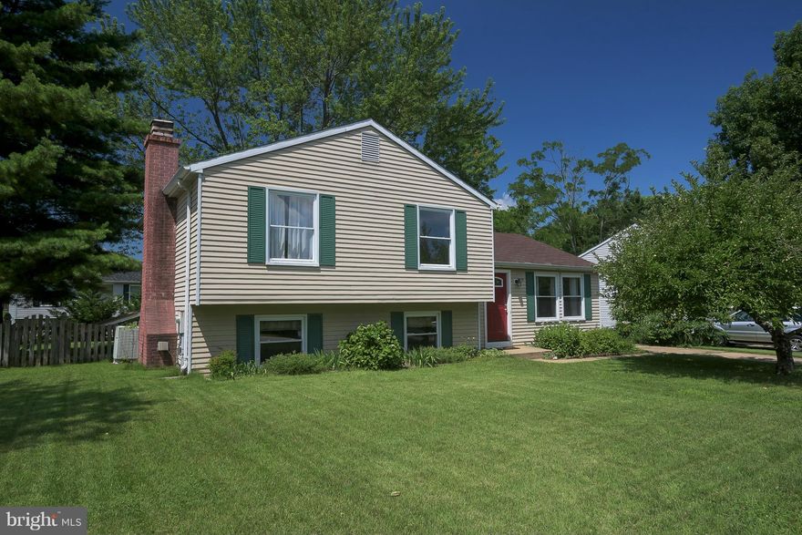 Cute as a button!  Vaulted ceilings, open floor plan, tons of natural light, neutral colors.  Gourmet kitchen w/ white cabinets & appliances.  Master suite w/ full bath, 2 additional bedrooms and second full bath complete the upper level.  Lower level family room w/ wood burning fireplace & 4th bedroom.  Fully fenced yard, deck and patio area.  Short walk to baseball fields and Belvedere Elm.