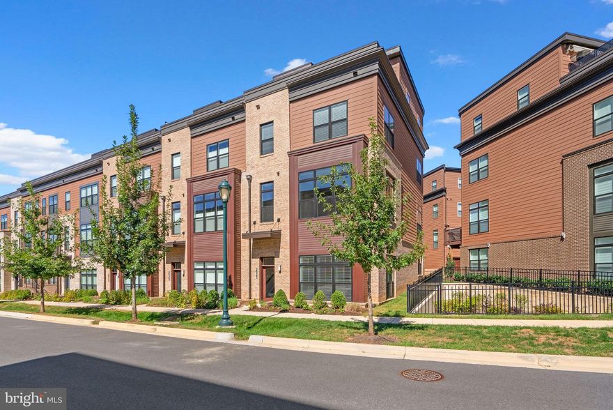 LUXURY 4 LEVEL END UNIT-ELEVATOR-ROOFTOP TERRACE - TOWER OAKS Quite possibly, the best offering in North Bethesda, this stunning four-level elevator home in highly desirable Tower Oaks is sure to impress! Located in the heart of North Bethesda surrounded by amenities galore! The epitome of luxurious living, this home provides a space that is designed to maximize today’s lifestyle, and then some, surrounded by a choice of fine dining, recreational options, grocery choices, shopping and more. A southern exposure in this end-unit home welcomes natural sunlight on every level. This home is in pristine condition with gleaming hardwood floors, high ceilings, a roof top terrace, gas fireplace, pre-wired for cable, elevator, an open concept floorplan with a chef inspired gourmet kitchen that opens to a family room and dining space with ease. You can entertain on the mid-level deck that is off the kitchen or enjoy Woodmont Country Club golf views from the roof top deck. The upper-level hosts three bedrooms and two full baths. The primary suite has an attached primary bath and walk-in closet. The upper 2 level has a recreation space that is prewired for Audio/Video and opens to the rooftop deck, another bedroom and a full bath. The entrance level of this home hosts a bedroom/office with an attached bathroom and connects to the two-car garage, wired for 2 EV chargers and driveway. This home is nestled in North Bethesda’s most chic community, which boasts a state-of-the-art tot/lot, basketball, swimming pool, gymnasium, yoga studio, a community center with a party room, business center and two onsite managers. Tower Oaks was voted by Bethesda Magazine as the "Best Townhome Community of 2022"! The center of the Community is the CORE, a lifestyle and recreation center. The low HOA fees include use of the CORE, featuring state of the art fitness center, yoga room, Amazon Hub, Resident Cafe/Lounge, activity room, club room, outdoor pool with lounge areas, barbeque grills, firepits, tot lot, green space and sport court. Conveniently located just minutes from Route 270, shopping centers and restaurants such as Founding Farmers, Clyde's, Pike & Rose, and Park Potomac. This home offers urban conveniences without sacrificing the tranquility of suburban living. There is ample guest parking in the community, easy access to Metro, 270, 355, 495, airports and more. Choose to dine or shop at Pike & Rose, Tower Oaks, Park Potomac, Rockville Pike corridor with easy access to all.