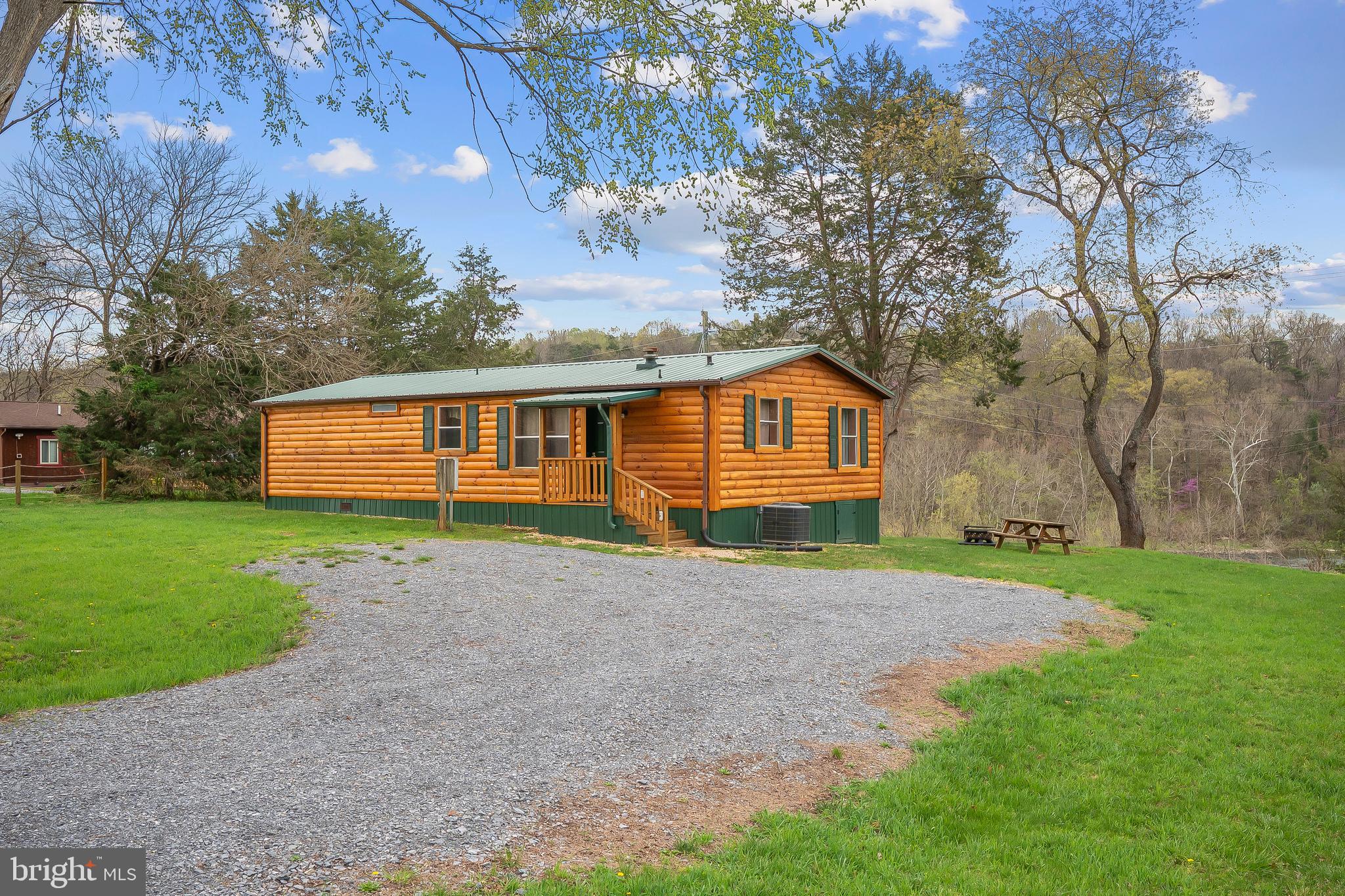 River front cabin perfect for a weekend getaway or possible vacation rental. Be lulled to sleep by the din of the water flowing over the Luray power dam in this charming river cabin. Perched on a hill above the river, this 3 br, 2 ba home features new log siding, roof and other updates. Enjoy all of the fun the Shenandoah River has to offer including fishing to tubing. The back deck is perfect for overlooking the river, drinking your morning coffee and cook-outs!