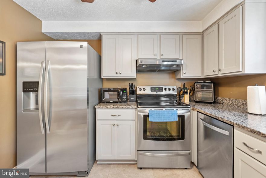 Updated Townhome in Prime Location! Step inside and be welcomed by gleaming hardwood floors flowing through the spacious living room, filled with natural light and perfect for entertaining. The dining room seamlessly connects to the updated kitchen, complete with new cabinets, ample prep space, granite countertops, and modern finishes. A main-level powder room adds convenience for guests. Upstairs, the primary bedroom offers plenty of space and generous closet storage in the walk in closet, alongside a full bathroom with a relaxing tub/shower combo. Two additional bedrooms provide the perfect setup for guests, family, or a home office. The fully finished lower level expands your living space with a second family room or rec room, a full bathroom with walk in shower, and a dedicated laundry area. Step outside to enjoy summer BBQs on the deck or gatherings in the fully fenced backyard. With 1 assigned parking spot, commuting is a breeze. Updates include: Roof (2024)! Conveniently located near Route 216, I-95, Route 1, and Route 29, this home offers easy access to shopping, dining, and more.