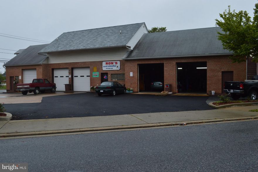 Well maintained automotive facility with 5 bay garage, vehicle lifts and office.  Corner lot with ample parking lot that can hold up to 25 cars, newer roof, and possible 2 apartments above garage.  This has been a successful business for the more than 20 years and only selling due to owner retiring.