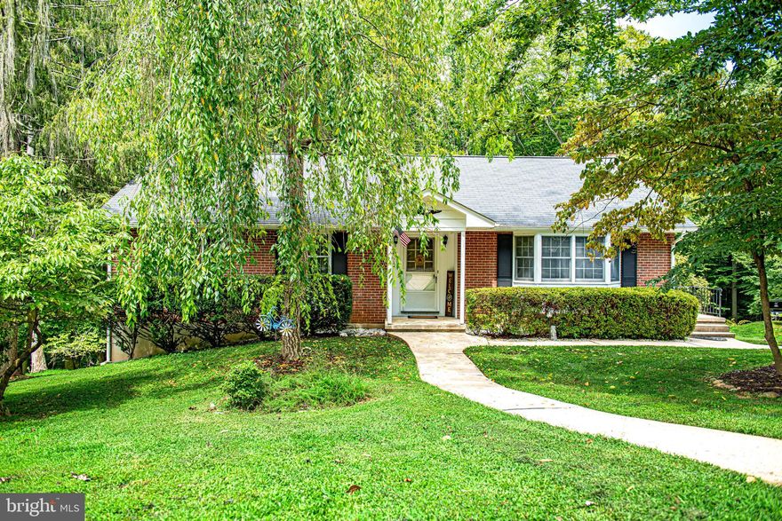 HOME SWEET HOME! Absolutely beautiful rancher nestled in a park like setting. Enjoy nature from the deck overlooking the woods. This home features a spacious living room with a cozy pellet stove, built in bookshelves & large picture window with a view of the woods. The dining room area adjoins the living room with an exit door to the deck ( 26 ft x 14 ft Trex) . The galley kitchen is located off the dining room and has a bay window & space for a breakfast table.  On the main level the primary bedroom features a large closet & updated private primary bathroom. The other two bedrooms share a full bathroom located in the hallway.  In the lower level of this home is a large family room with a wood burning fireplace . The exterior door in the lower level allows access to the backyard ( walk out level) . There is a half bathroom on the lower level with plumbing rough in to add a shower in the future. The laundry is located in the hallway of the lower level. Cedar closet for storage. The wrap around driveway leads to the rear of the home where the entrance to the oversized two car garage is located. This allows for plenty of off street parking.  One Year CINCH HOME WARRANTY paid by the seller for the buyer at settlement. The home offers an abundance of living space! Hurry , this home is a real GEM!