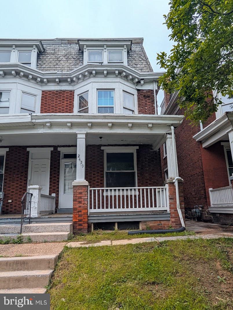 This spacious 4 bedroom brick home has much to offer! Hardwood floors, plenty of kitchen cabinets, covered porches on both sides of the house, and a covered balcony overlooking the fenced back yard!