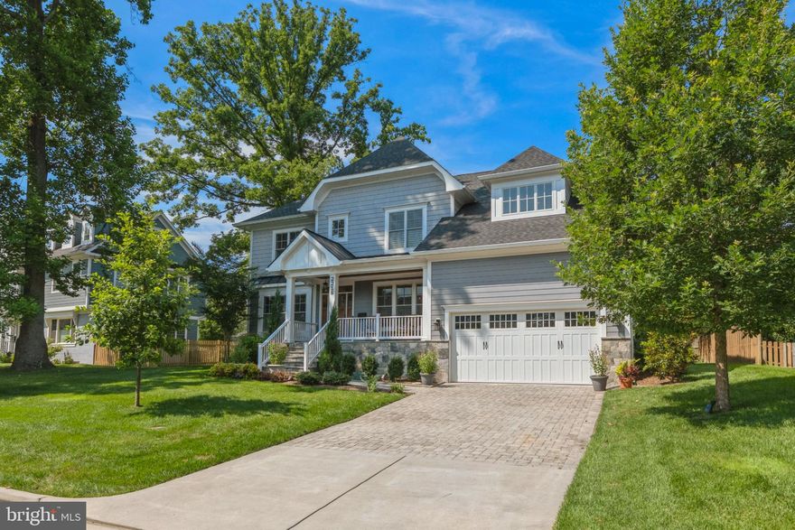 JUST REDUCED BY $100,000!  Built by MR Custom Homes, this like new, beautiful 6 bedroom, 5.5 bath Craftsman-style home features over 6,000 sf of living space on 3 levels, perfectly situated on a .23 acre lot. A landscaped yard leads up to the front flagstone porch highlighted by a warm hardwood ceiling and space for outdoor seating. Inside, 9 ft ceilings (all levels) and gleaming white oak hardood floors with white-wash finish (main and upper floors) graciously connect the foyer to an adjacent front office and opposite dining room, each with recessed lights, crown moldings, and upgraded trim. An open concept living room and kitchen is centered around a 42' gas fireplace with white stone surround and built-ins, plus a coffered ceiling, upgraded recessed lighting, and a breakfast nook. The gourmet kitchen is a chef’s dream, boasting a KitchenAid range, separate wall oven, and microwave, a Viking refrigerator, under-cabinet lighting, and unique "leather-finished" quartzite countertops, marble backsplash, and a large center island. A walk-in pantry plus a separate butler’s pantry with quartzite counters, marble backsplash, wine storage, and beverage fridge complete the kitchen and dining areas. A spacious mudroom leads to the 2-car garage with epoxy floors, while the rest of the first floor is complete with a powder room and a main-level bedroom suite, currently configured as an office.  A wide, sundrenched oak staircase leads to the second level which features hardwood floors, 9’ ceilings, 4 bedrooms and 3 full baths, including a grand owner’s suite with 2 large walk-in closets, and a master bath with dual sinks, honed marble flooring, plus marble countertops, shower, and standalone tub. A second-floor laundry room with porcelain floors, custom cabinets, marble countertops, Speed Queen washer/dryer, plus an elevated platform/drain for washer/dryer, rounds out the upper level of the home. Downstairs, the lower level features 9' ceilings, a bedroom (currently configured as an office), full bath with walk-in shower, plenty of storage space, and is showcased by an open rec room and a theater room with stadium seating and built-in speakers in the walls. Outside, flagstone steps lead out from the family room to the paver patio of the flat and partially fenced backyard that includes a shed and upgraded, higher capacity gutters/downspouts. Additional amenities and upgrades of 2218 Tulip include CAT6 Home Runs to 2 offices, the theater room, and the master bedroom providing direct high-speed internet, Hunter Douglas plantation shutters and shades, and a battery backup sump pump for the main sump pump. Situated on a beautiful lot in Westmoreland Park, this residence is ideally located just moments from Rte. 66/267, Metro’s Orange and Silver Lines at West Falls Church and East Falls Church Stations, and restaurants and retail of Downtown Falls Church, Arlington, Tysons, and DC.  2218 Tulip lies in the McLean HS/Longfellow MS/Haycock ES pyramid of Fairfax County Public Schools.