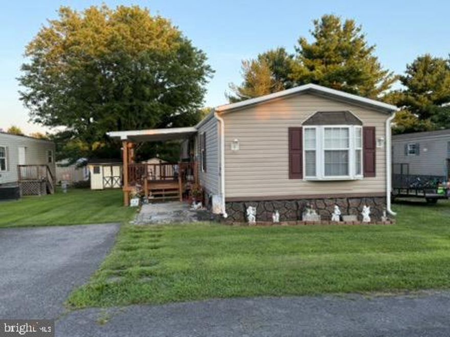 Back on market!  Won't last long!!  Coming soon on 8-8-2025.  This 2006 Mobile Home is 16 X 80.  This is a 1280 sq ft home            3-bedroom,  2-bathroom.  Nice front porch!  This makes home ownership affordable on a convenient rented lot. Imaculate home is one of a kind.  Move in with nothing to do.  Owner has upgraded many items, painted, etc.       
Owner considering selling FULLY FURNISHED!!  Both OUT BUILDINGS convey!

PUBLIC OPEN HOUSE SATURDAY 8-30-2025 1:00 to 3:00    Open houses will be held once weekly.

*Purchaser must submit a rental application to the HOA Manager and be approved before closing. Purchaser must also meet, agree, and follow ALL guidelines set by the HOA.* ***Limited Services Disclosure***  The seller retains responsibility for negotiation, disclosures, and all contractual decisions related to the sale.