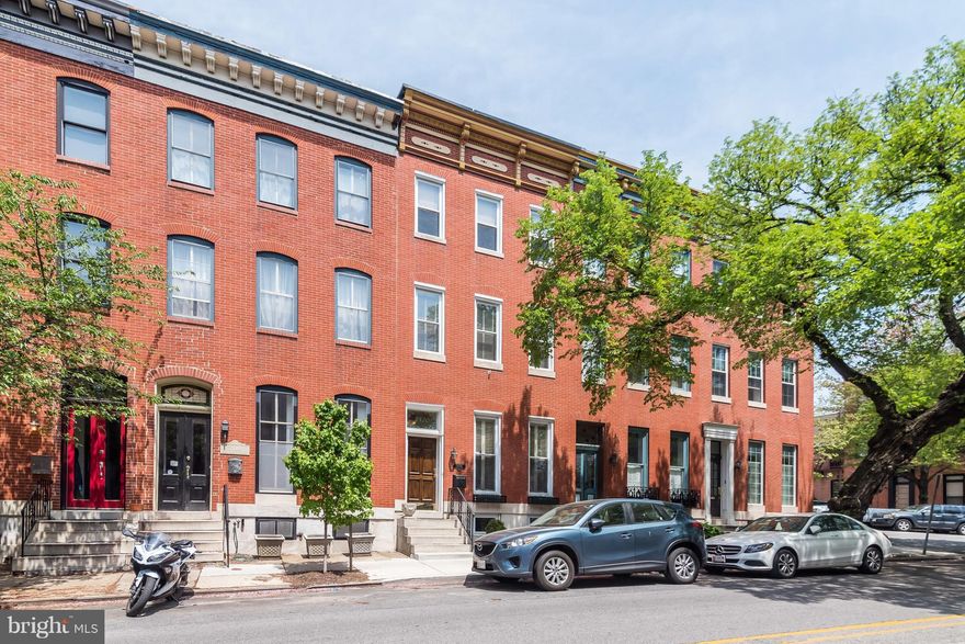 Quintessential Butchers Hill home w/ over 2,500 Sq/ft of living space! Formal Living & Dining rooms w/ crown molding, expanded gourmet kit w/ Corian counters & great cabinet space, main lvl half bath, 2nd level w/ 3 bedrooms & 1 full bath, 3rd level oversized Master Suite w/ wet bar area & full bath, rooftop deck w/ stellar city & water views & Private rear patio! Only steps to Patterson Park!