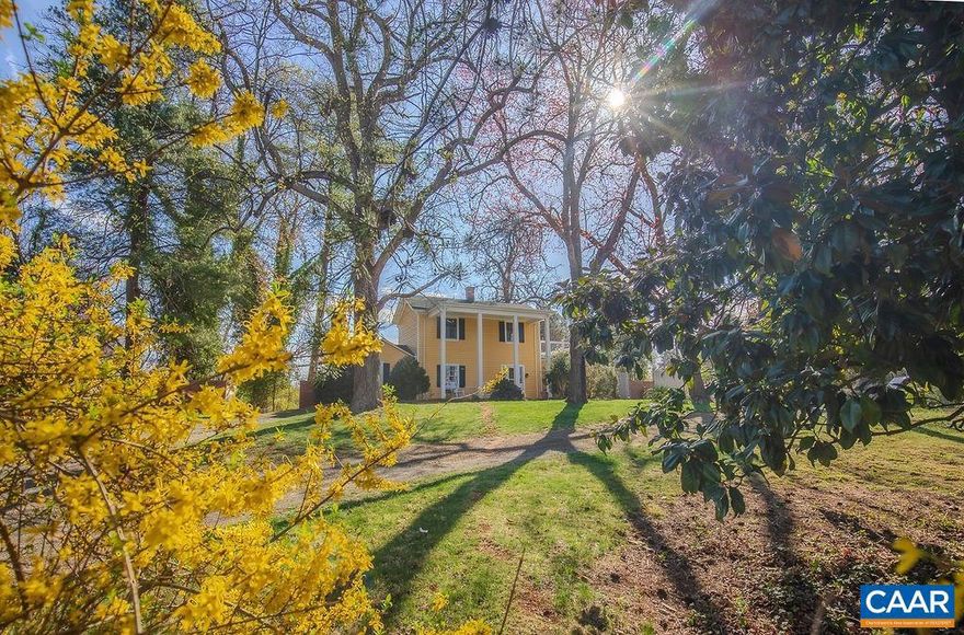 Step into history with this beautifully updated, light-filled 1800s farmhouse, once the original homestead that later became this charming neighborhood. Featuring 3 bedrooms and 2 full baths, this home is nestled on a private, landscaped lot with lush gardens, mature trees, and a certified wildlife habitat, creating a peaceful retreat. Outdoor living shines with a stone patio, a spacious front porch, and a rear deck?perfect for unwinding with a glass of wine. Inside, extensive renovations blend modern comfort with timeless character. Large windows flood the space with natural light, showcasing original architectural details alongside beautifully updated finishes. A rare opportunity to own a piece of history while enjoying modern conveniences?this one-of-a-kind home offers privacy, charm, and natural beauty in an unforgettable setting!,Fireplace in Living Room