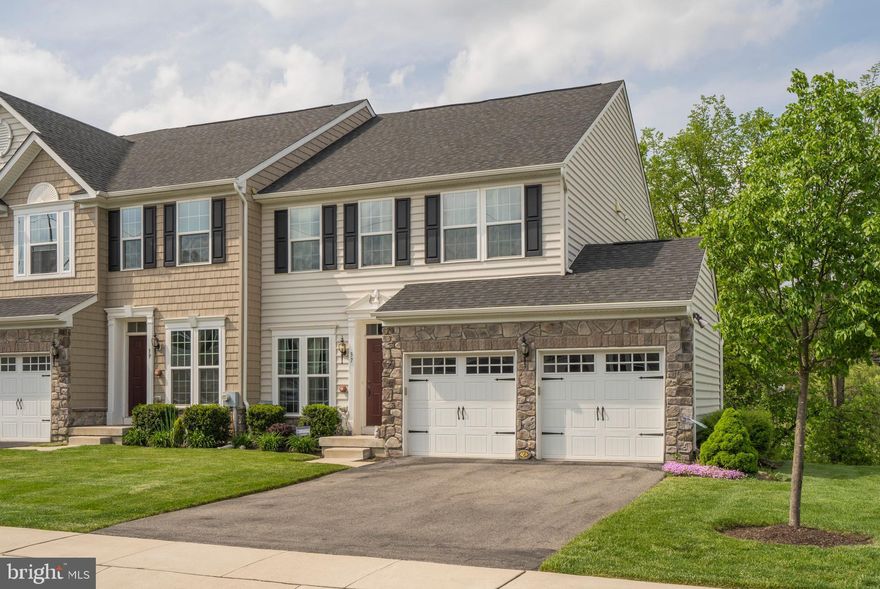 Welcome home to wonderful living at Springfield Manor. This END UNIT townhome is located on  the ABSOLUTE  BEST lot in the community and affords the next lucky homeowner with a bounty of natural light, privacy, and freedom from lawn maintenance and snow shoveling! The spacious living room is simply beautiful and leads to the open concept kitchen with family room and eating area. The kitchen has a double sink, granite countertops, SS appliances and cheery white cabinetry. These owners spared no expense,  and had the builder put in bump out, making this one of largest homes within the community, allowing for plenty of room for gatherings. The gas fireplace adds the perfect atmosphere in the winter months.  Upstairs you have the master suite, two large bedrooms, a full hall bathroom, and laundry room. The master suite is everything you could imagine; large walk in closet, and bathroom with an oversized shower and double sink.  The current owners are using one of the bedrooms as  home office, and the other as a guest room. The finished basement is a walkout, allowing for more natural light.  Outside, the oversized deck allows for pure serenity and privacy overlooks nature's beauty and nears the community walking trail.  This home is located in the prestigious Springfield Township School District with the brand new, state of the art, elementary school, and near to Sandy Run, North Hills, and Manufacturer's Country Clubs.   Also close to Fort Washington and Oreland Railroads and convenient to 309 and the turnpike. . Call to set up an appointment today, this is better than new!