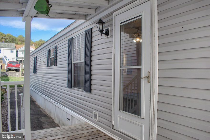 Call today for this MOVE IN READY mobile with off-street parking in Atlas. Tucked away in this established neighborhood, this home features a side porch and rear covered patio for summer BBQs. A cute fenced yard with shed and off street parking for 2 cars!! Inside 2 nice sized bedrooms- 1 with walk in closet, new flooring and a convenient walk in shower. Low taxes and easy living can be yours in this priced to sell property. Investors this would also make a nice rental ! Call for your private tour today ! Square footage to be independently verified by the buyer.