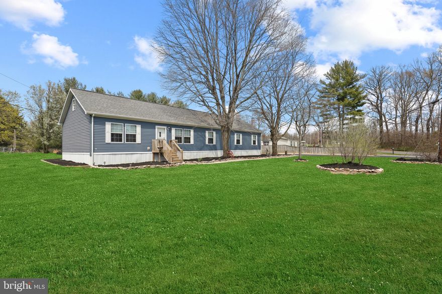 Welcome to 1820 Carsins Run Rd - Located on a beautiful cleared and level .53 acre lot with NO HOME OWNERS ASSOCIATION FEES OR RESTRICTIONS * This 5 year young manufactured home has just been completely refreshed inside and out * Featuring 4 bedrooms, 2 full bathrooms, &  a large  two-car detached garage * The spacious main level includes a large sun living room, updated kitchen with faux granite counters,  & sliding glass doors leading to a large level lot with plenty of space for entertaining and activities * Primary bedroom with  primary bathroom and massive walk-in closet & 3 additional bedrooms each complete with large closets * The side entrance provides access directly to the laundry room for a place to kick your shoes off and hang your coat.  Attic above is massive a storage room with subfloors and lighting already fully installed * Property is directly across the street from State owned and protected woodlands, right down the street from Stoney Demonstration State Forest, and the neighboring farm is in agricultural preservation.  Also, gutter guards were installed on all the gutters on the house! No more picking leaves out of your gutters!  Attic could potentially be finished to nearly double the living space!