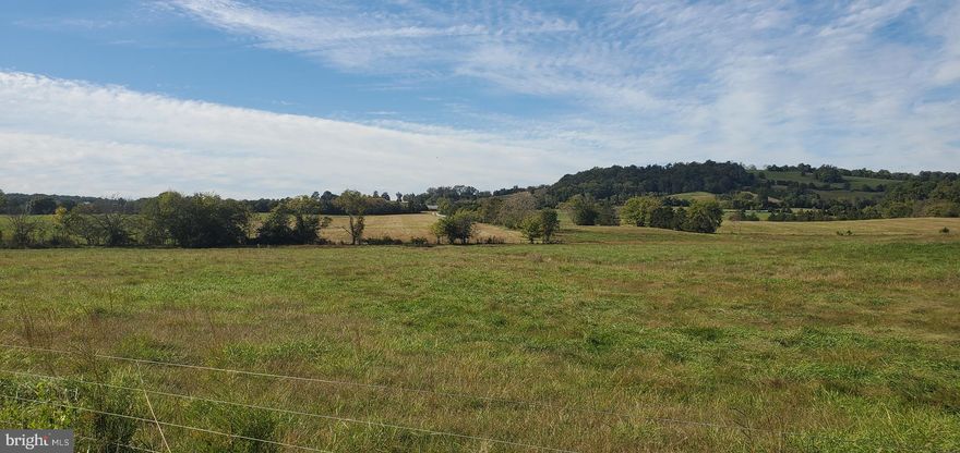 This beautiful scenic farm consists of 484 acres of gently rolling and level crop and pasture land.   Located  in an area of large estates and farms , it is a prime location outside the town of Orange.  The property includes 2 comfortable tenant houses, a large Morton machine shed/workshop storage facility andbarn, and cattle handling and feed lot facilities as well as other farm buildings. 
The acreage is in 4 separate tax parcels, 3 of which are protected by a conservation easement allowing a division of up to 4 parcels total. The 4th parcel ( 50 acres) is not in easement, fronts on Constitution Hwy  and Route 628 and can be easily developed into smaller lots.  The property is being sold in it's entirety.
The land parcels are currently configured in the following parcels:  (1) 133.51 acres ( Parcel Record #6962) which contains a  large 3 bedroom/ 2 1/2 bath  house and the workshop/machine shed as well as Mountain Run, a tributary of the Rappahannock River; (2) 175.39 acres. ( Parcel record # 21078) includes two barns,  Harvestore silos and feedlot structures and old homestead that served as a tavern in colonial times.  While the homestead remains unrenovated, ag buildings (barns, silos, and feedlot) are in fine shape and fully functional parts of the active cattle operation on the farm; (3)124.93 acres ( Parcel# 21079) This parcel contains about 35 acres of timber-able woodlands, large open croplands, and a 3BR / 1BA brick house.   There is a large (approx ½ acre) pond on this parcel as well; and (4)  49.69 acres ( Parcel  #21080) which fronts on Constitution Hwy (Rt. 20) and Route 628 and contains woodlands and cropland.
The farm is currently leased for cattle grazing and feedlot, and hay and crop production.   An excellent passive investment opportunity, or the chance to operate a first class farm facility. 
Approximately  40 minutes to Charlottesville, 95 minutes to Washington, DC.   Private aviation facilities are within a five minute drive.