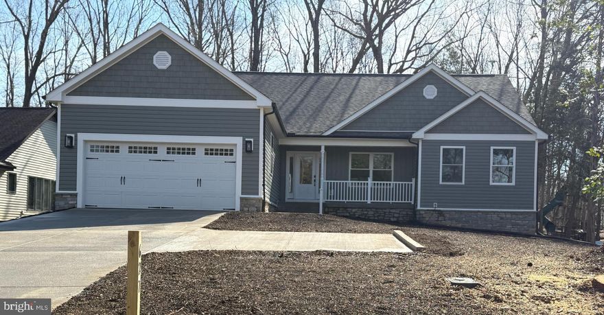 A wonderful three-bedroom , two and a half bathrooms Ranch style house. Step from the covered porch directly into this spacious living room that is part of an open floor plan. Spacious beautiful kitchen with Stainless Steel appliances and granite countertops, lots of storage.  Master suite that has a large walk-in closet and the en-suite bath with a double vanity and large shower. Quality construction, private concrete driveway, attached garage with electric door opener,  covered concrete patio, fireplace. Located in the desirable Lake of the Woods community, this home has everything you're looking for, including easy access to all the amenities you need: lakes, marinas and boat slips, several beaches, 2 swimming pools, a golf course, an equestrian center, a club house, a campground, tennis courts, parks and walking paths.***Photos in listing are similar to home under construction, but not exact**