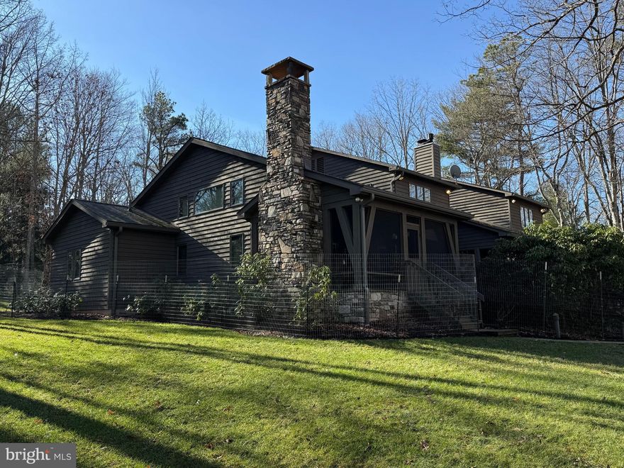 A rare opportunity to  own a lakefront property in the Blakeslee.  Located in one of best coves and communities on Deep Creek Lake, the 4 bedroom, 3.5 bath property offers the perfect home and lot package for the best in lakefront living.    

The 1+ acre wooded property with 150' of premium frontage was the first building site purchased when the development opened .  The gently sloping wooded sunset facing lot provides easy access to the lake and dock areas.  The current owners have added multiple landscape upgrades including paver stone walkways along with lakeside picnic and fire pit areas.    A paved circular driveway provides easy year round access from the street.  

With lake and summer sunset views from nearly every room,  the well designed home offers an open floor plan featuring plenty of window coverage.  The main level offers a recently upgraded kitchen and lake facing eating area.   A large lake facing great room with fireplace adjoins a cozy family room with its own fireplace and direct deck access.  The recently added primary bedroom suite includes a spacious bedroom, luxurious bath, 2 walk in closets and a bonus room currently used as an office.  The second floor includes a second primary suite and two spacious bedrooms along with a loft.    There is also a lower level with a room that could be a game and or work out area.     

Many would consider the recently added lakeside covered porch with impressive wood fireplace their favorite spot.  It offers direct access to the new deck and primary suite.   

The property also offers an attached 2 car garage and a detached 24 x 24 garage with plenty of interior height for boat and or tall vehicle storage.    Additional upgrades and features includes the addition of a  detached 2 car garage, complete deck replacement, whole house generator, replacement and updated  HVAC and security systems.   The roof shingles have also been recently replaced .  

Blakeslee is considered by many to be the finest community in the Deep Creek Lake area.  The developers believed quality was more important than quantity and designed a community with great amenities and over 100 acres of open space that is restricted from additional development.   Blakeslee has also attracted a healthy mixture of full time and vacation owners.   The self managed community offers many unique amenities.   These amenities include a community center with indoor heated pool, locker rooms, kitchen and decking.   Two tennis courts along with a basketball and pickleball courts are well maintained .  A multipurpose field is available for outdoor games.  A trail system runs through the wooded areas for area residents.  Other important features include a storage areas for boats and trailers along with a dedicated trash removal area.  

It all adds up to a a great opportunity to experience all the benefits that home ownership in the Deep Creek Lake area has to offer.  Schedule your showing today as homes for sale in this community typically don't last long.