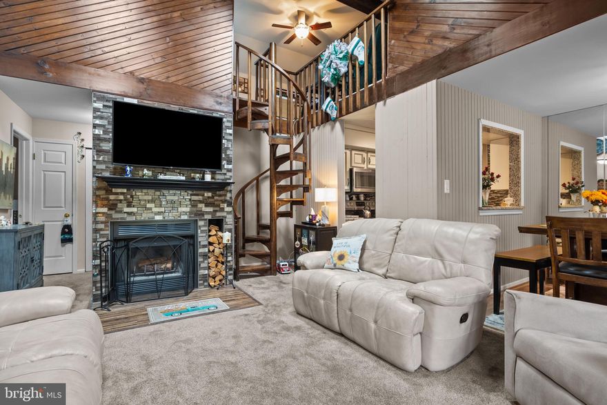 Welcome to this stylish, sunny 2 bedroom, 1.5 bathroom home nestled in the quaint Lower Bucks County neighborhood, Hampton Greens. This unique layout boasts cathedral ceilings, a family room/den loft and arguably the best view in the entire community! The living room offers a sense of tranquility with sunshine pouring through skylights, an exquisite fireplace as the cozy centerpiece, and a scenic balcony overlooking tall trees and a grand lawn, perfect for admiring the local foliage! Mirrors, skylights, accent lighting fixtures, high ceilings and neutral tones throughout the living room, dining area and bathrooms add to the bright and expansiveness feeling this well maintained home commands. Newer flooring, stainless steel appliances, countertops, and backsplash grace the elegant kitchen. The two large bedrooms feature adequate closet and storage space, and the master ensuite bathroom, accompanied by a jack-and-jill style full bathroom, boast a newer look that will have you feeling right at home. Convenience and comfort have never been so stylish! Everything this community has to offer is only a short walk away, from the swimming pool/hot tub complex, to the tennis courts, club house, an updated fitness room, or even get out of the house and go for a stroll on one of the delightful walking paths to admire the beautifully manicured community. This home and community have so much to offer, reach out today for more information!