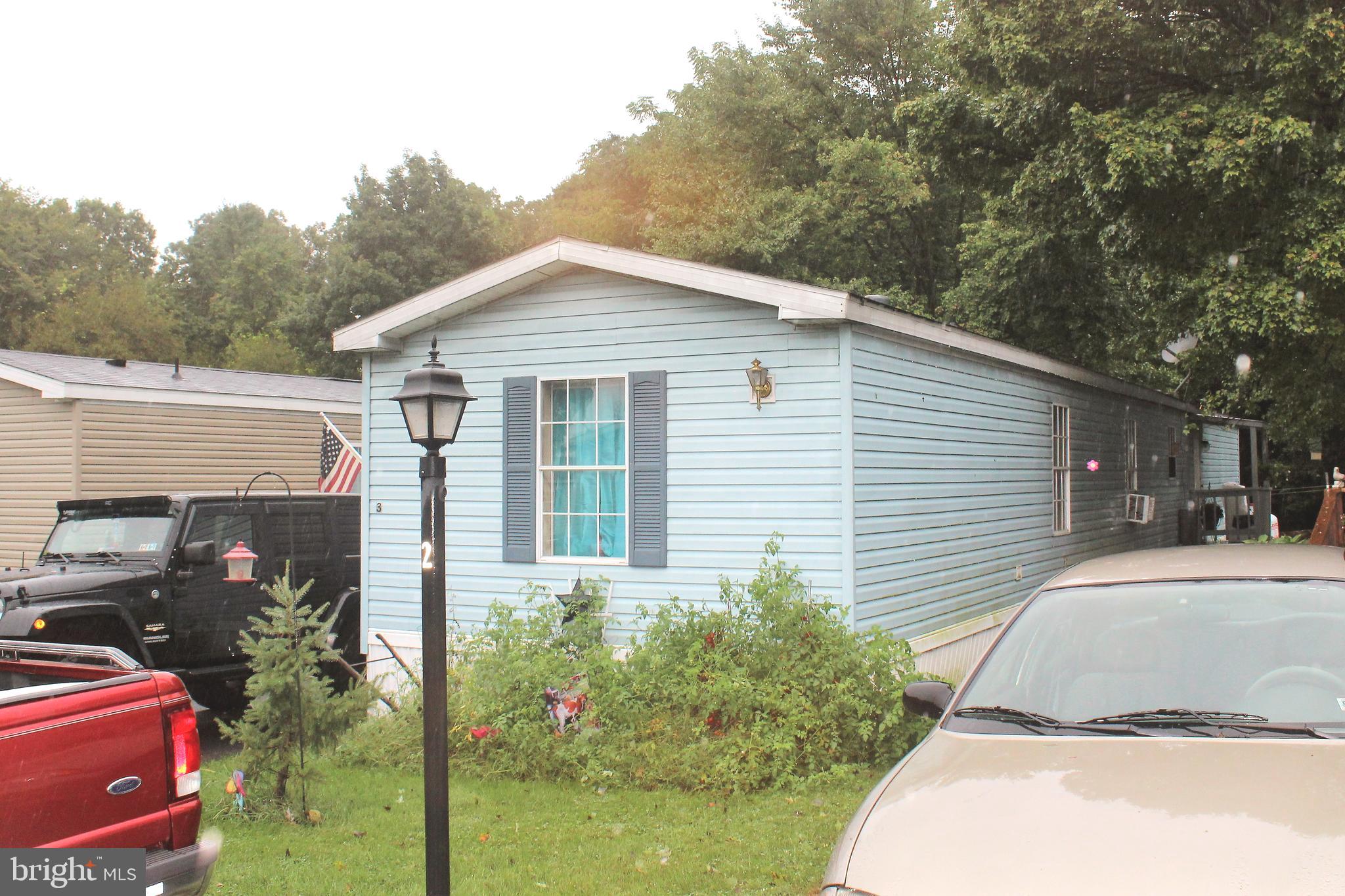 Fantastic 2000 Redman 14x80 mobile home with HAndicap ramp and accessibility! Watch the deer and turkeys from your porch as they graze through the yard. Tranquil setting! Large covered deck with additional sunsetter awning to cover "open" area on those hot summer days. New metal roof on shed! Enjoy very cheap lot rent @ $300/mo and includes Water, sewer, and trash!