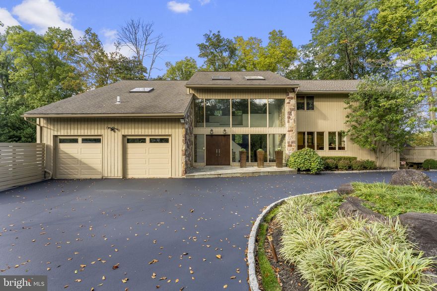 Welcome to 925 Stoke Road, where elegance and comfort await you. Step through the inviting front door into a sunlit, grand entryway with soaring ceilings. The open, transitional floorplan seamlessly guides you through this remarkable home.

As you enter, the living room captivates with oversized windows that bathe the space in natural light. The focal point is a stunning fireplace surrounded by exquisite stone, perfectly complementing the dark wood floors. To the right, the dining room awaits, providing an ideal setting for family gatherings and entertaining.

Prepare to be amazed as you venture further into the kitchen, reminiscent of a magazine spread. A cozy sitting area with a desk and an oversized booth create a charming space for family meals, work, or relaxed conversations over coffee.

Completing the first floor is a spacious family room adorned with beautifully crafted built-in shelving and convenient access to the patio.

Ascend the stairs to discover an expansive primary suite, boasting two walk-in closets, a luxurious bathroom, and a serene sitting area. Adjacent to the bedroom, find a versatile space perfect for an office, homework area, or simply unwinding. Down the hall, three generously proportioned bedrooms and two well-appointed bathrooms offer ample space and storage.

The lower level of this magnificent home is impeccably finished, featuring three distinct areas. A large recreation space with sliders leading to the backyard, a comfortable bedroom, and a well-equipped gym provide endless opportunities for relaxation and entertainment. A full bathroom adds convenience to this level.

Step outside into a backyard oasis, complete with a sparkling pool, a charming bluestone patio, and picturesque bluestone planters. The expansive space invites endless play and enjoyment, creating a private paradise of its own.

Visit 925 Stoke Road, where every detail has been thoughtfully designed to provide a truly exceptional living experience.