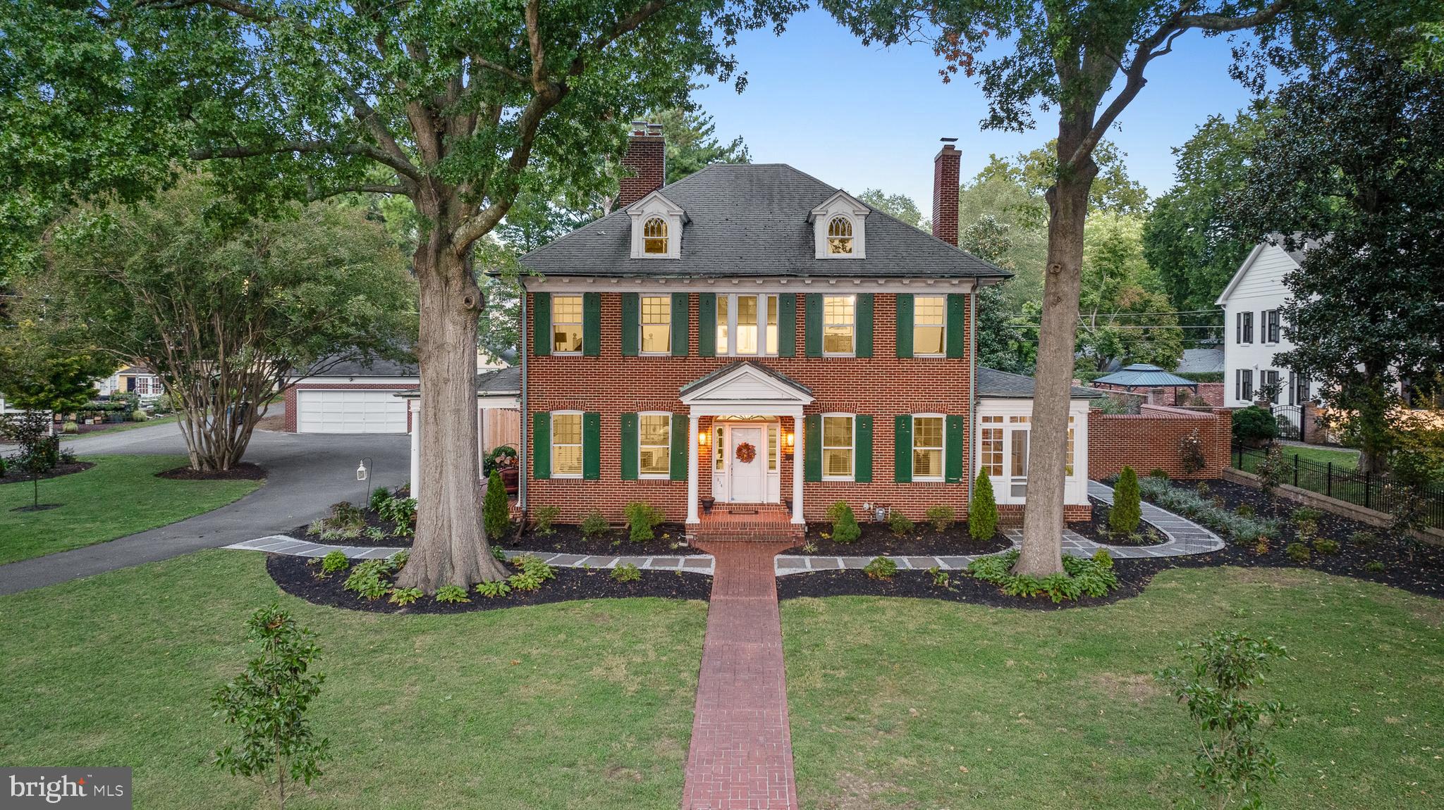 Lovely brick colonial situated on expansive double lot in the heart of historic Easton. This 4 bedroom, 3.5 bathroom home is brimming with classic charm from the side entry leading into the traditional “warming room”, to the period details found throughout including light fixtures and doorknobs. The kitchen is modern yet retains vintage appeal as it has new stainless steel appliances, durable laminate flooring and refinished original cabinetry with refurbished handles. Custom moldings and millwork found throughout the home add a touch of elegance. Each bedroom has direct access to an updated bathroom. New HVAC added to the second floor. Sunroom with wall of windows provides abundant light. Detached two-car garage and ample parking with circular drive. This stunning home is an absolute must see if you love classic charm with modern amenities. Just blocks from downtown Easton’s shops, restaurants and entertainment.