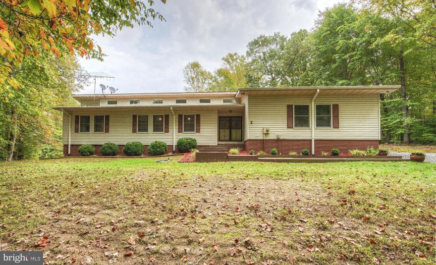 Welcome Home to this Ranch Style Home on 5 acres. Custom Built Home featruing a large Family Room a w/stone Fireplace and Vaulted Ceilings. Beautiful 400 sq.ft. All Season Room which opens up to 3 Decks and an Amazing Backyard w/ Hot Tub. Large Updated  Kitchen with SS appliances and Corian Countertops. Updated Master Suite with Luxury Bath also opens up to Back Deck. A Must See! Horses Welcome!