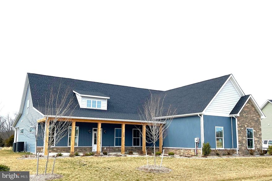 Welcome to the Estates at Edgemoor! This luxurious community offers dazzling, upscale home styles with 1 acre+ lots and are close to the VA line in Berkeley County. Open up your living space with the Camelia model a spacious 4,500+sqft, 5 bed, 4.5 bath rancher with wainscoting, an open concept floor plan, and 10ft ceilings on the main level. The kitchen shines with upgraded appliances, a Quartz island with a built in cabinet microwave, double ovens, and touchscreen cooktop. The primary bedroom is on the main level and has access to a rear porch. The primary bath boasts a double door bathroom, with huge walk-in double shower, soaking tub, and ceramic tile flooring. You will want to snuggle up with a good book in front of the gas fireplace in the 14x16 sunroom - which has access to both rear porches with ample entertaining space! 

The upper level of the home is just as large as the main level! There are an additional two bedrooms with their own bath. Entering the upper level, you will find a rec room with wet bar, a storage room, and a quiet sitting area. 

Other features include recessed lighting throughout the entire home, crown molding, and LVP flooring. On the exterior there are cedar shaker shingles, stone work, 3 car side loading garage, and a 12x40 front porch. Windows line every inch of this home so let the natural light flow through! Schedule your showing today to see what our newest community has to offer!