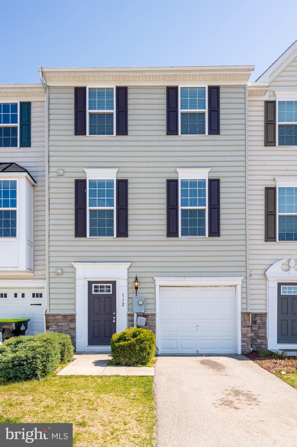 Move-in ready! Welcome to 112 Norwood Drive, conveniently located in the desirable Potomac Station subdivision in the heart of Spring Mills. This newly renovated townhome invites you in featuring mature landscaping, a front loading 1 car garage, and Carolina Beaded siding with a stone watertable accent. The fully finished lower level offers inside access to your garage, a new powder room and a spacious family room with a gas fireplace, perfect for relaxation and entertainment! On the main level you will find a spacious open concept to your kitchen and living room. The kitchen features 42' cabinets, a kitchen island with pendant lights, stainless steel appliances, a pantry, space for a kitchen table and access to your large rear deck! The main level also has an additional powder room for your convenience. Just upstairs you will find your primary suite with a large walk in closet and primary bath featuring dual vanities and tiled shower. Two guests bedrooms, 1 full bath and laundry room is also located on this floor. This home has brand new flooring and fresh paint throughout along with a bathroom on each level! Conveniently located near I-81, shopping, restaurants, and Spring Mills schools gives this home much to offer for any buyer! Welcome to your new home!