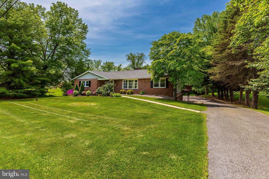 COMING SOON ON THURS 5/18-In a country setting just minutes from modern conveniences sits this spacious, open concept Rancher that has been fully remodeled (2017) and is move-in ready, complete with designer colors. Gorgeous wood floors in the living areas. Stunning kitchen with newer, soft close cabinets & stainless appliances (convection oven/range), island & quartz counters is open to the family room with wood burning FP.  Large open living/dining space in the front of the home greets visitors. Enjoy the sunroom & decks overlooking the above ground pool with it's own deck on this .77 acre, private lot. 3 bedrooms on the main level including the primary with plenty of closet space & charming bath. The lower level offers a large rec room with 2nd wood burning fireplace, half bath, laundry, storage & access to the oversized garage. Outside you'll find mature trees, a handy shed, stamped concrete patio, fire pit & plenty of space for just about anything you enjoy. New 3 ton heat pump, mini split & garage door-2020. Culligan water softener-2018. Seller prefers July 18th for closing.